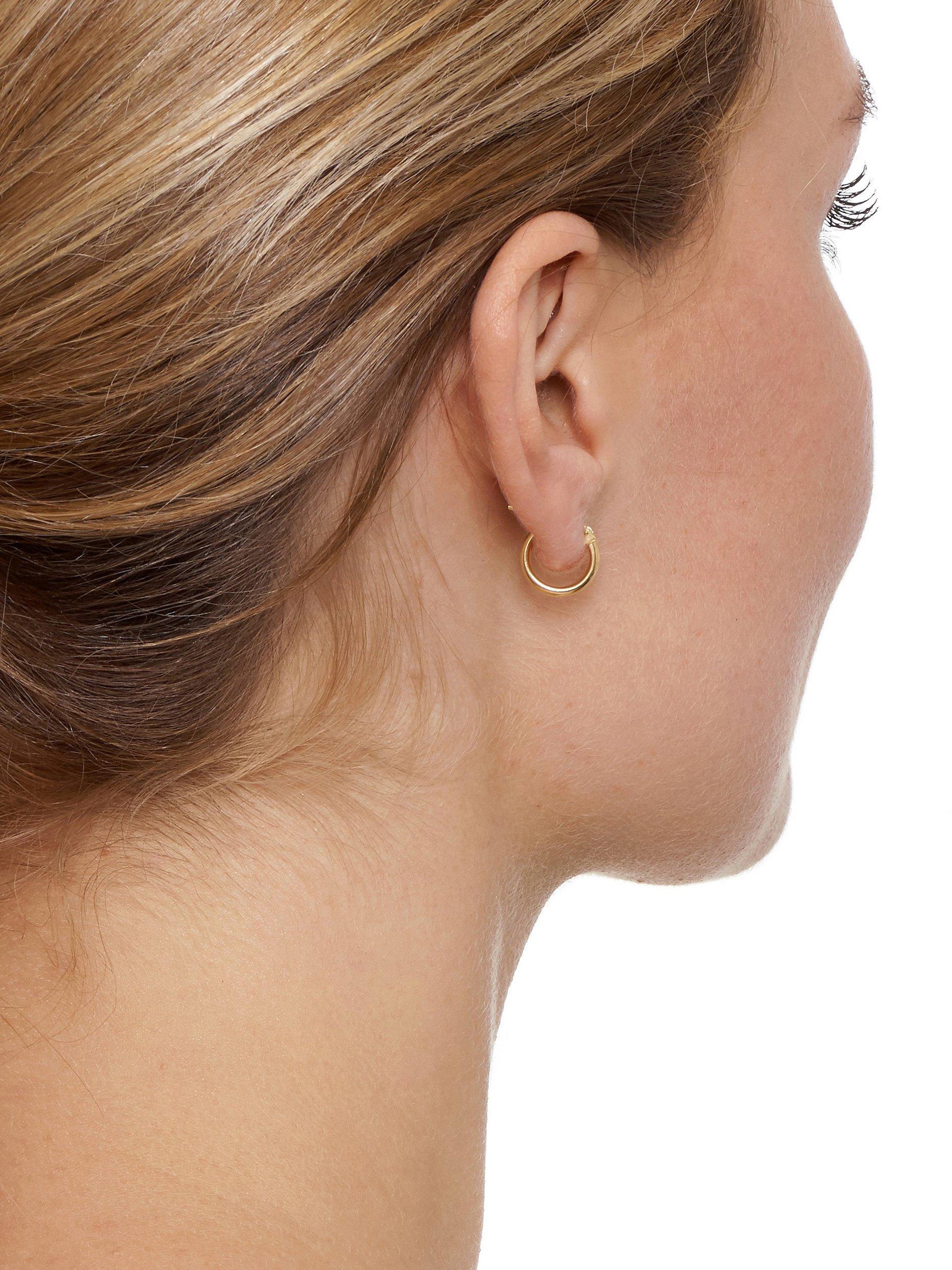Product image 2 of 3, which shows The Hoop Station La Elba Huggie Small Hoop Earrings, Gold