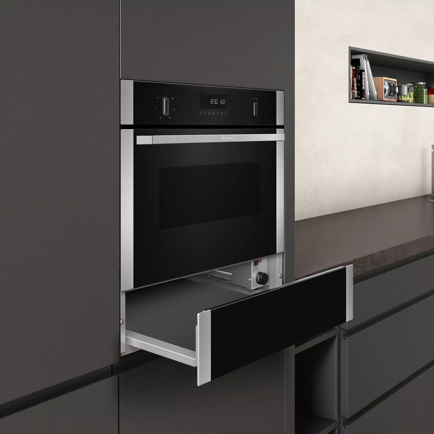 Modern built-in electric oven with pull-out warming drawer in sleek dark grey contemporary kitchen cabinetry