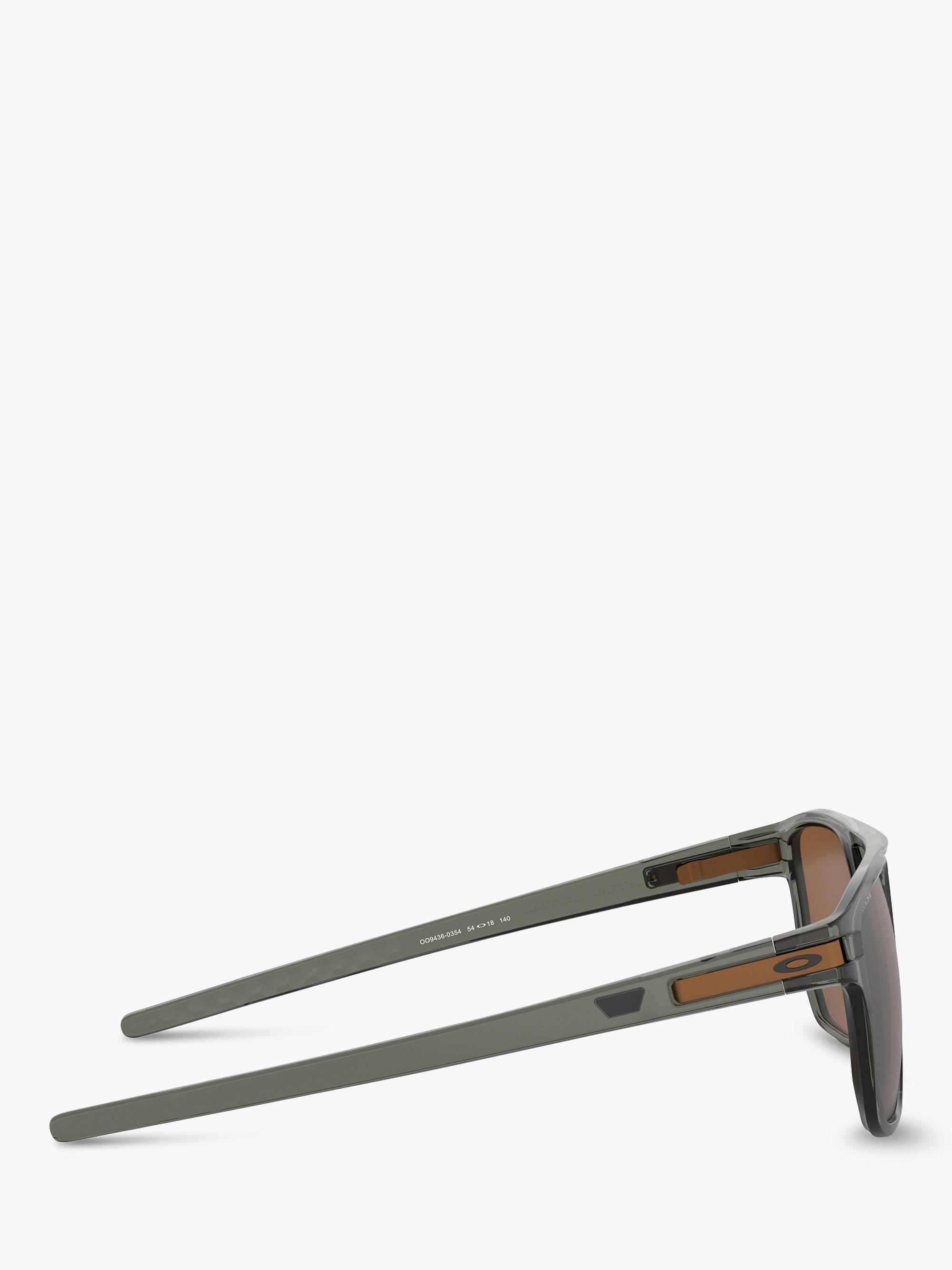 Product image 10 of 11, which shows Oakley OO9436 Men's Latch Beta Prizm Oval Sunglasses, Black/Mirror Brown
