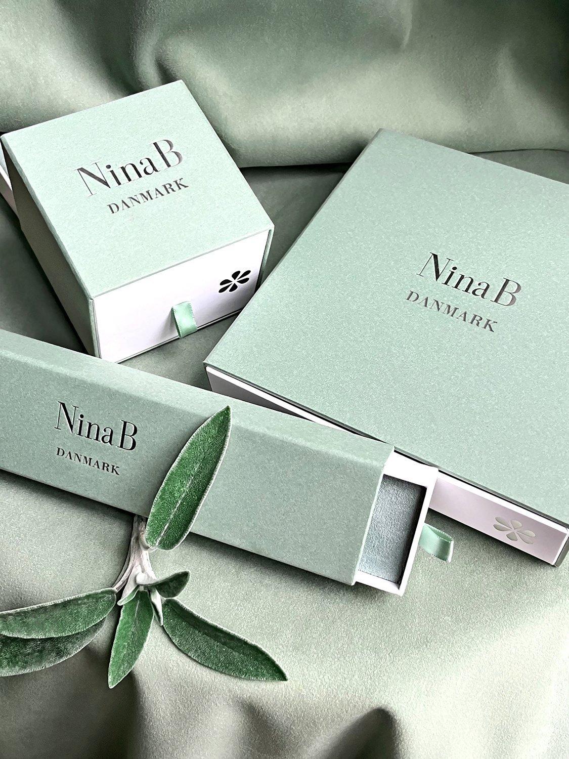 Product image 4 of 4, which shows Nina B Sterling Silver Oval Hoop Earrings, Silver