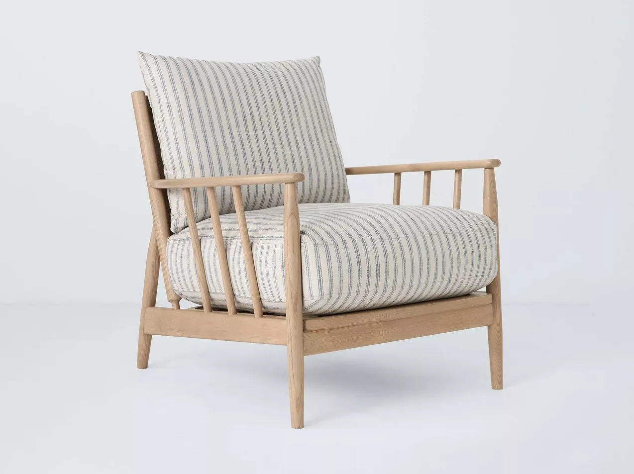 Wooden armchair with striped cushions.