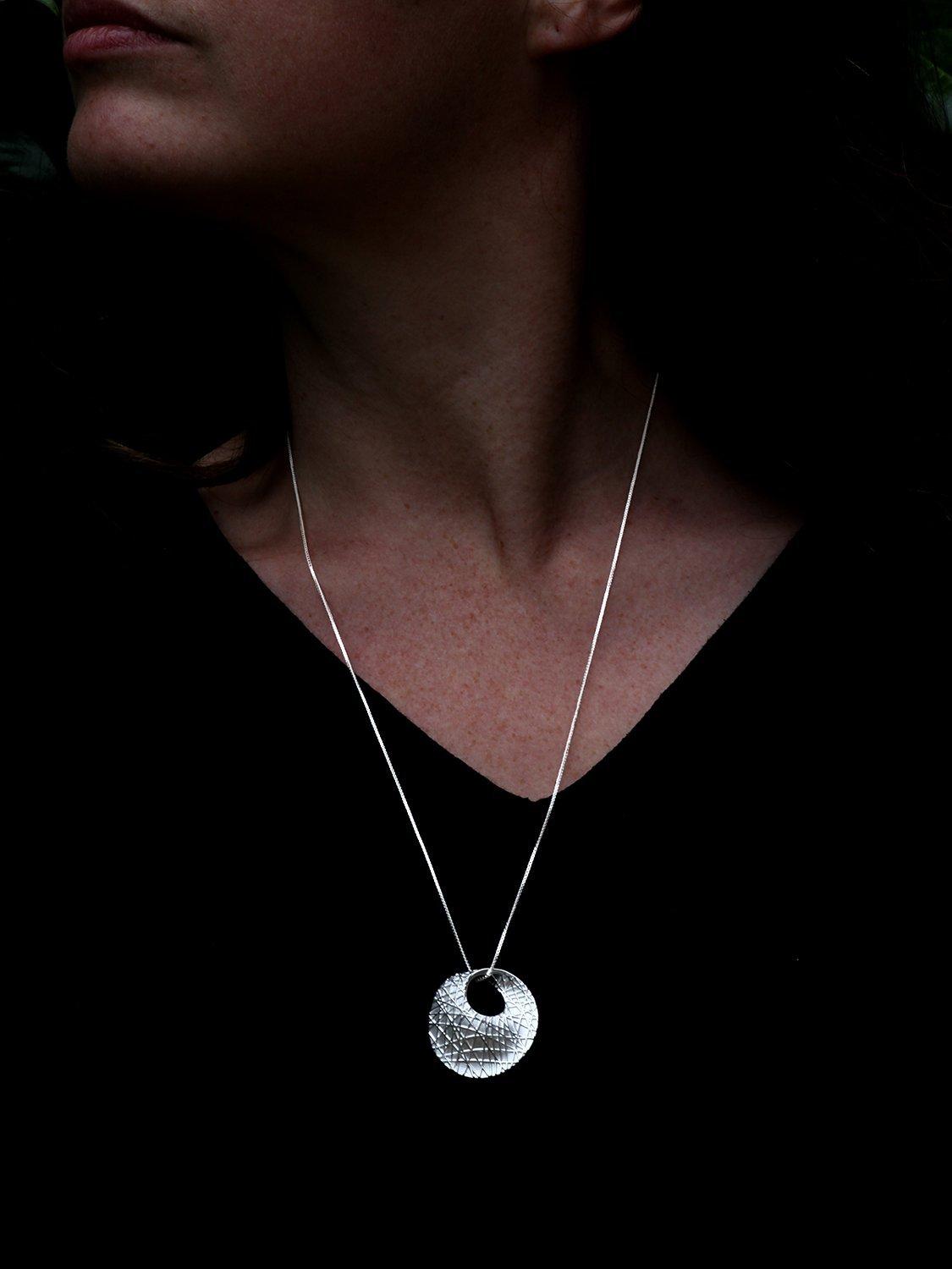 Product image 3 of 4, which shows Nina B Textured Mobious Round Pendant Necklace, Silver