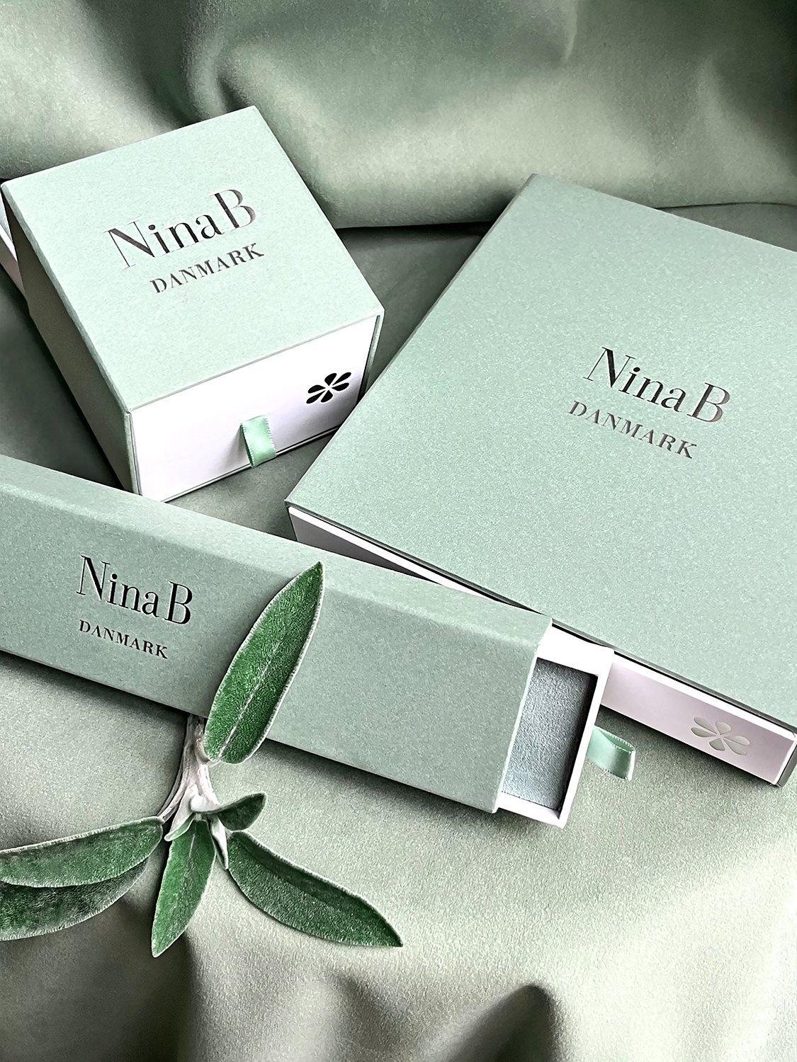 Product image 4 of 4, which shows Nina B Textured Mobious Round Pendant Necklace, Silver