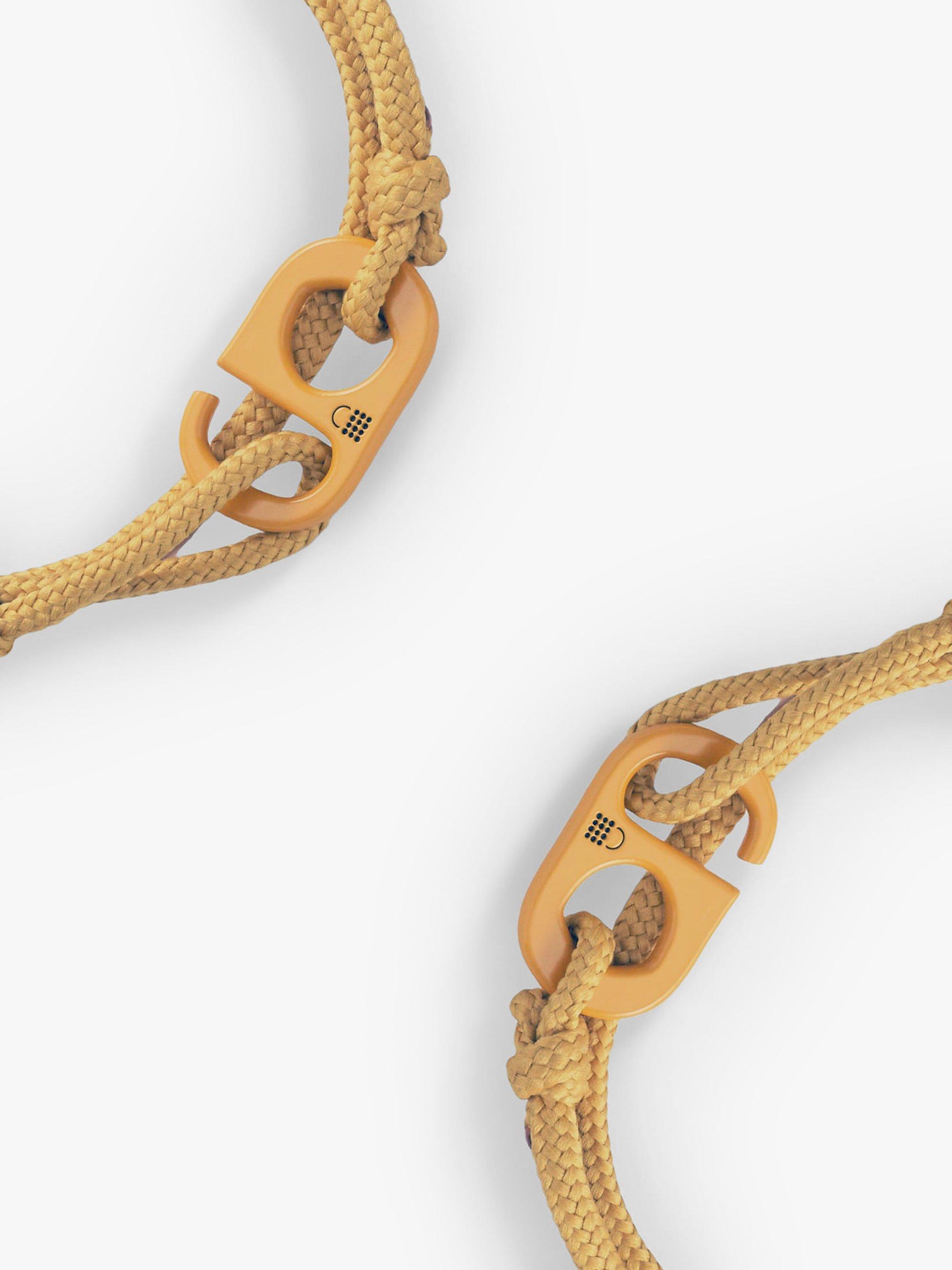 Product image 1 of 6, which shows #TOGETHERBAND UN Goal 12 - Responsible Consumption and Production Recycled Plastic Classic Bracelet, Pack of 2, Dark Mustard