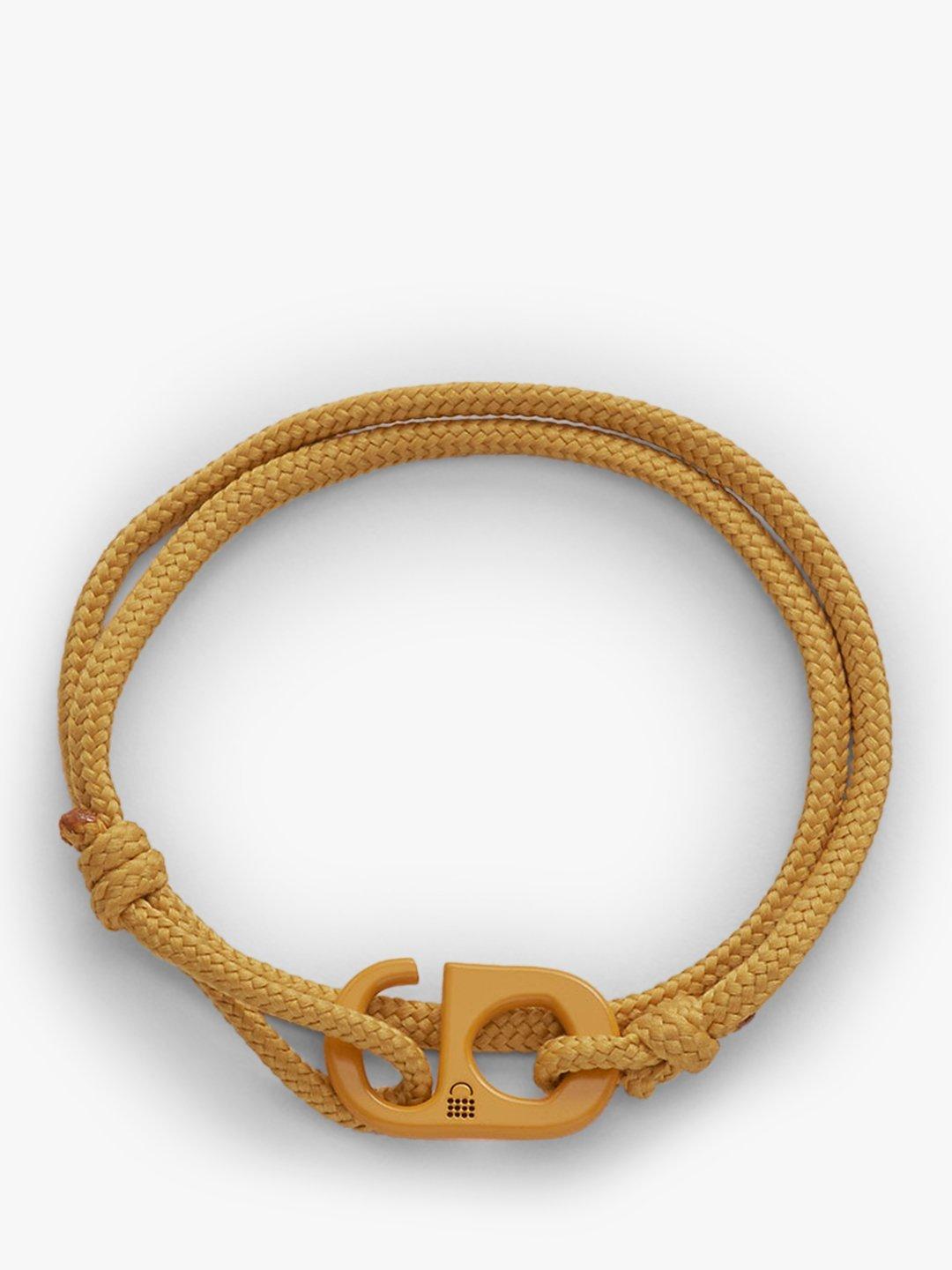 Product image 2 of 6, which shows #TOGETHERBAND UN Goal 12 - Responsible Consumption and Production Recycled Plastic Classic Bracelet, Pack of 2, Dark Mustard