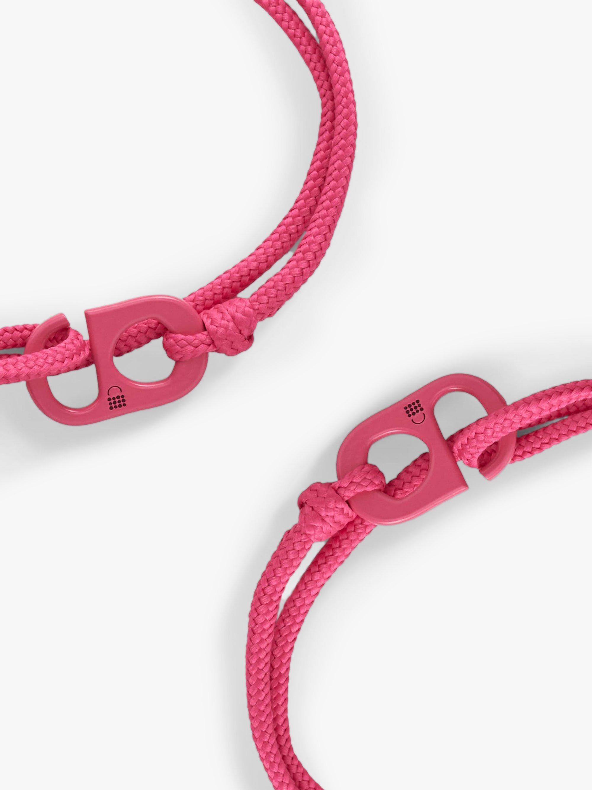 Product image 1 of 6, which shows #TOGETHERBAND UN Goal 10 - Reduced Inequalities Recycled Plastic Classic Bracelet, Pack of 2, Magenta