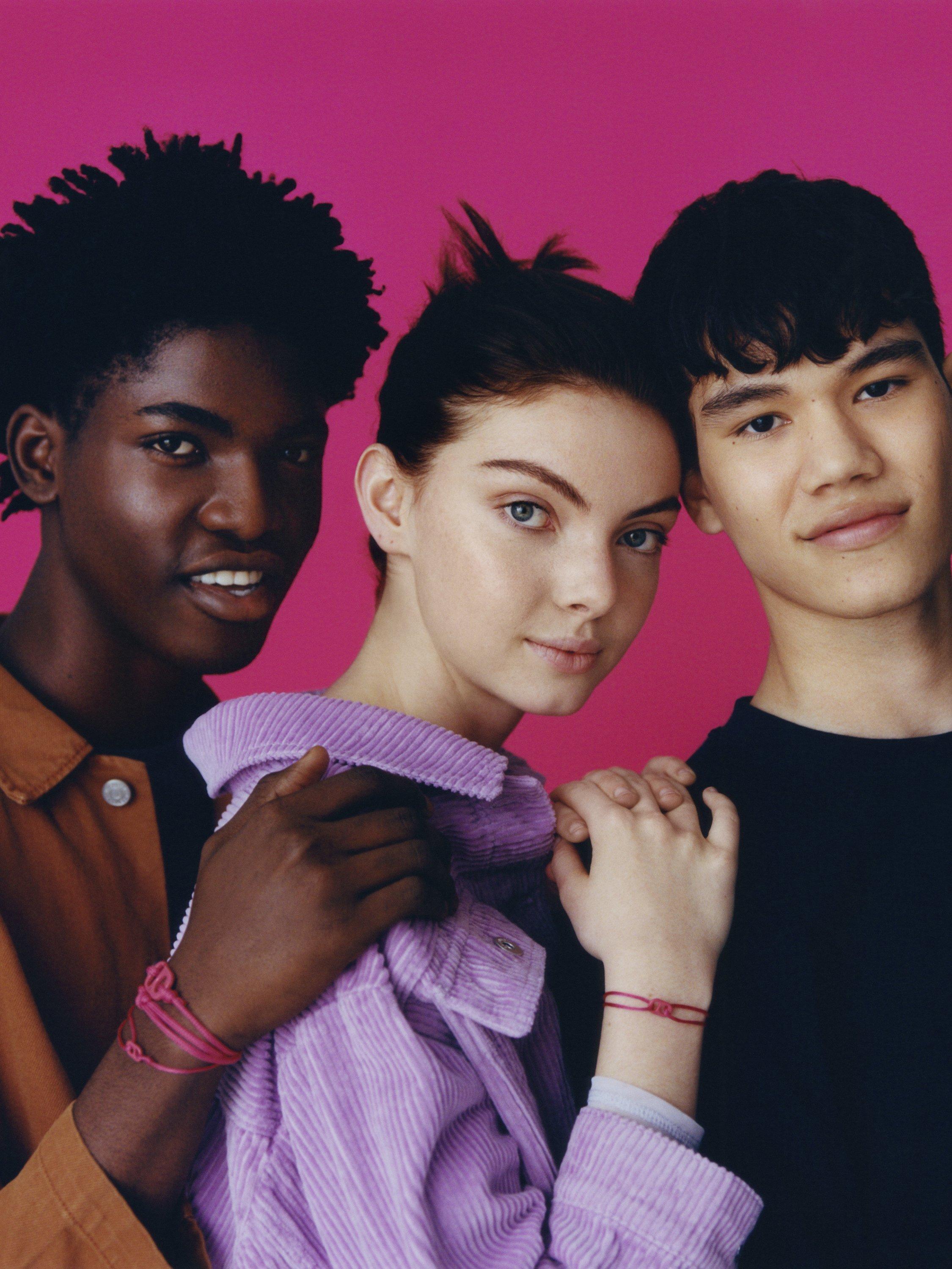 Product image 6 of 6, which shows #TOGETHERBAND UN Goal 10 - Reduced Inequalities Recycled Plastic Classic Bracelet, Pack of 2, Magenta