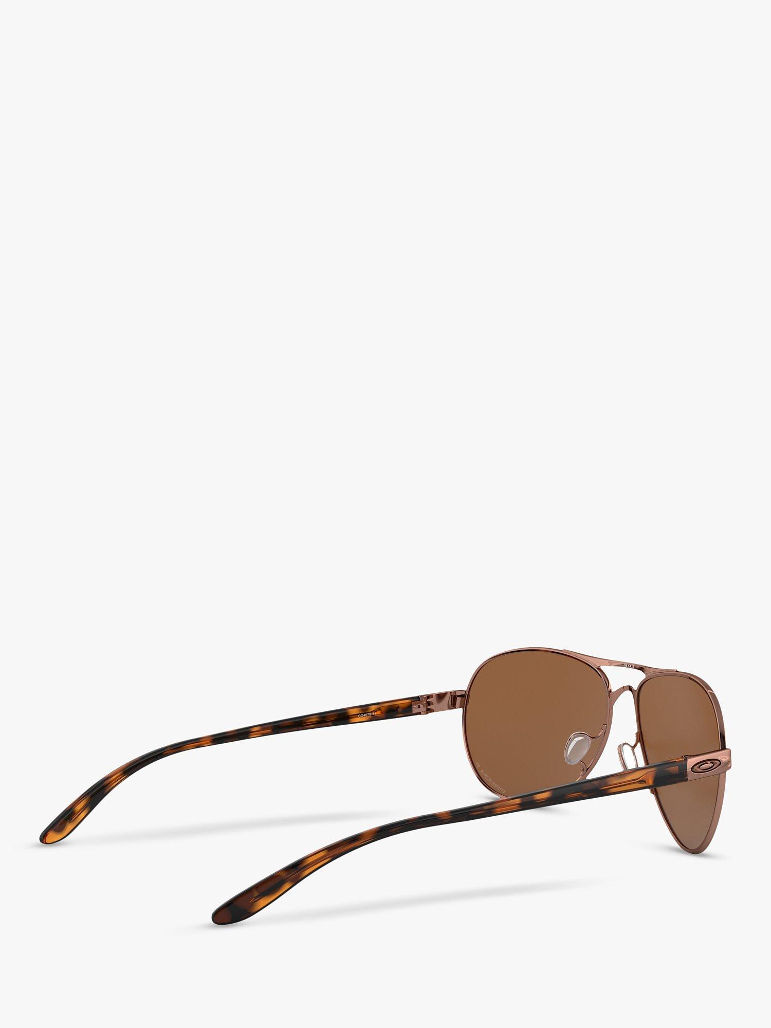 Product image 9 of 11, which shows Oakley OO4079 Women's Feedback Polarised Aviator Sunglasses, Rose Gold/Brown