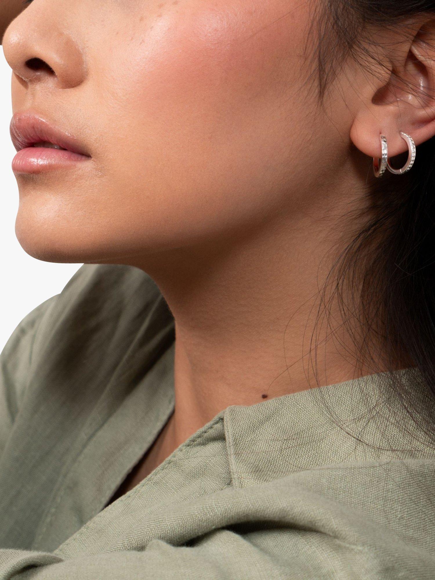 Product image 2 of 4, which shows Dower & Hall Large Hammered Story Hoop Earrings, Silver