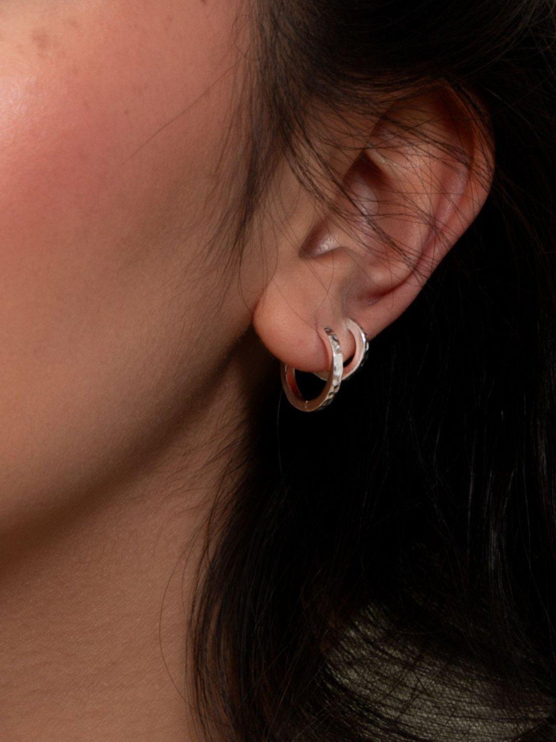 Product image 4 of 4, which shows Dower & Hall Large Hammered Story Hoop Earrings, Silver