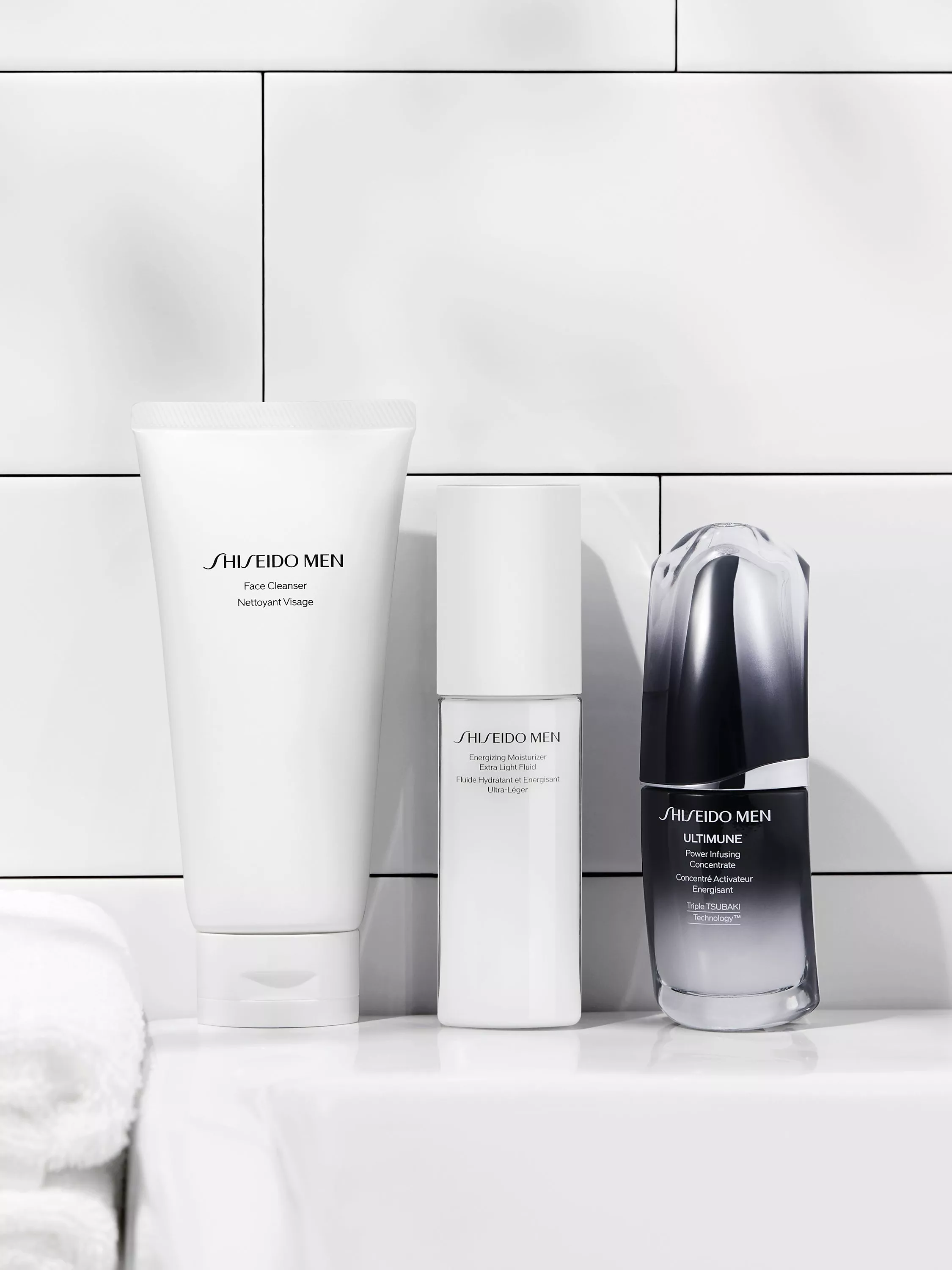 RITUALS Homme anti-ageing face cream bottle on marble stand in luxury bathroom with gold tap and towel