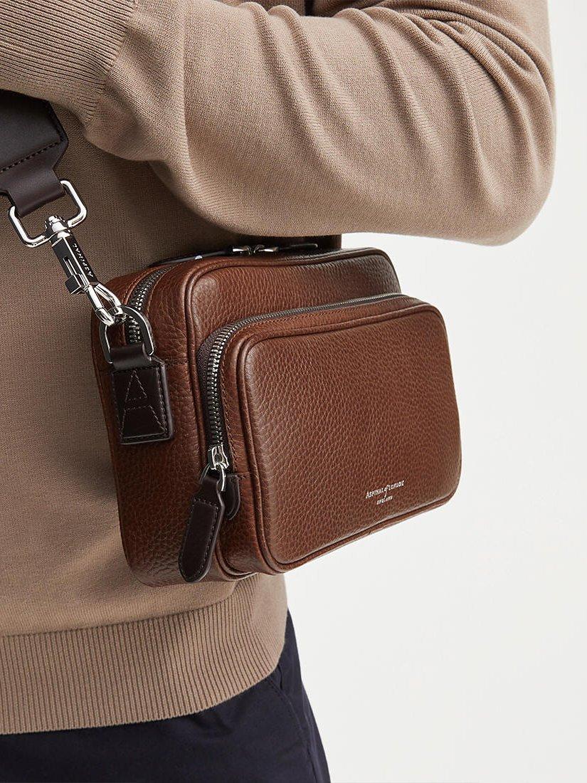 Product image 7 of 7, which shows Aspinal of London Reporter East West Pebble Leather Messenger Bag, Tobacco