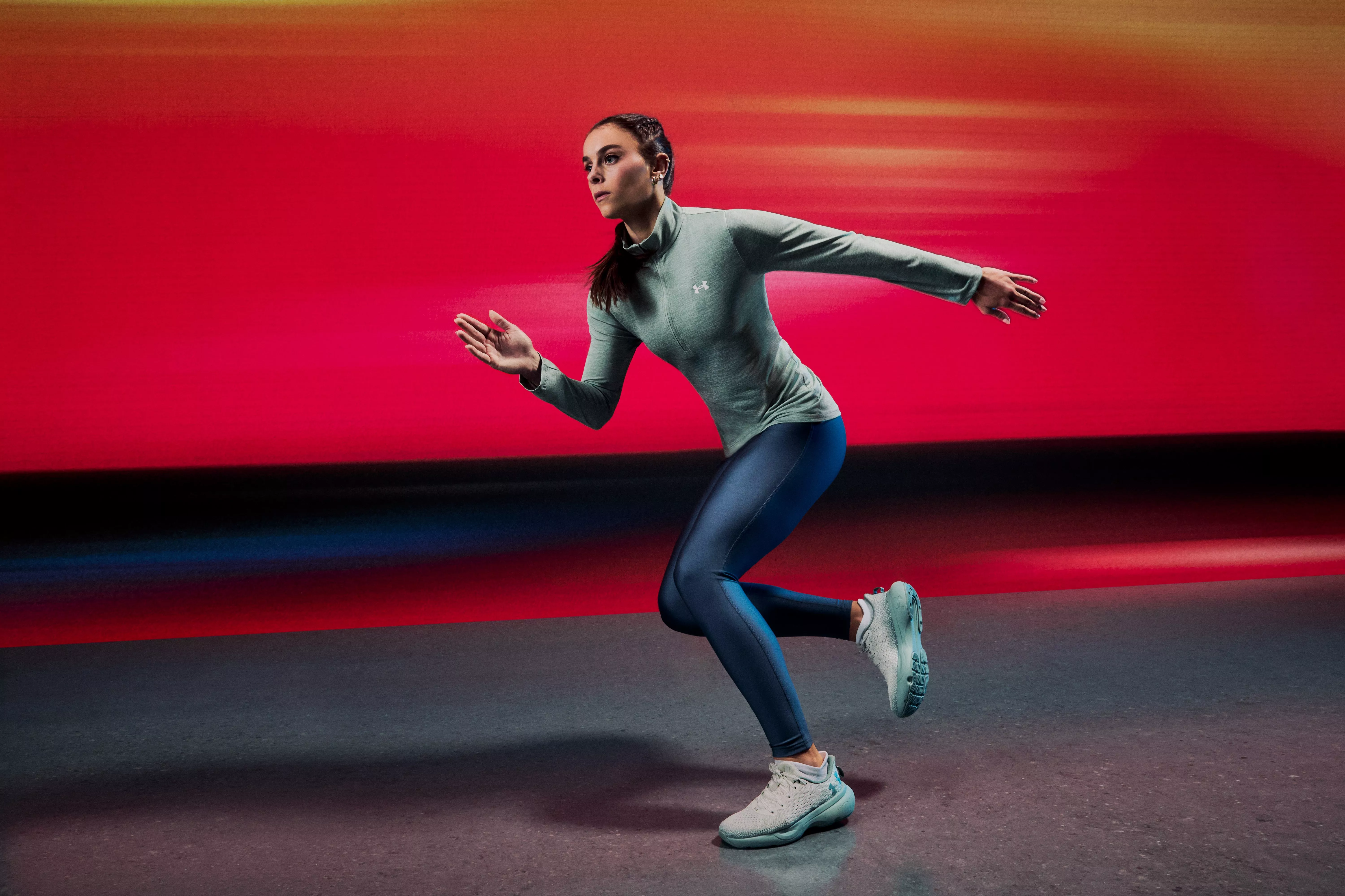 woman exercising wearing leggings and long sleeve top