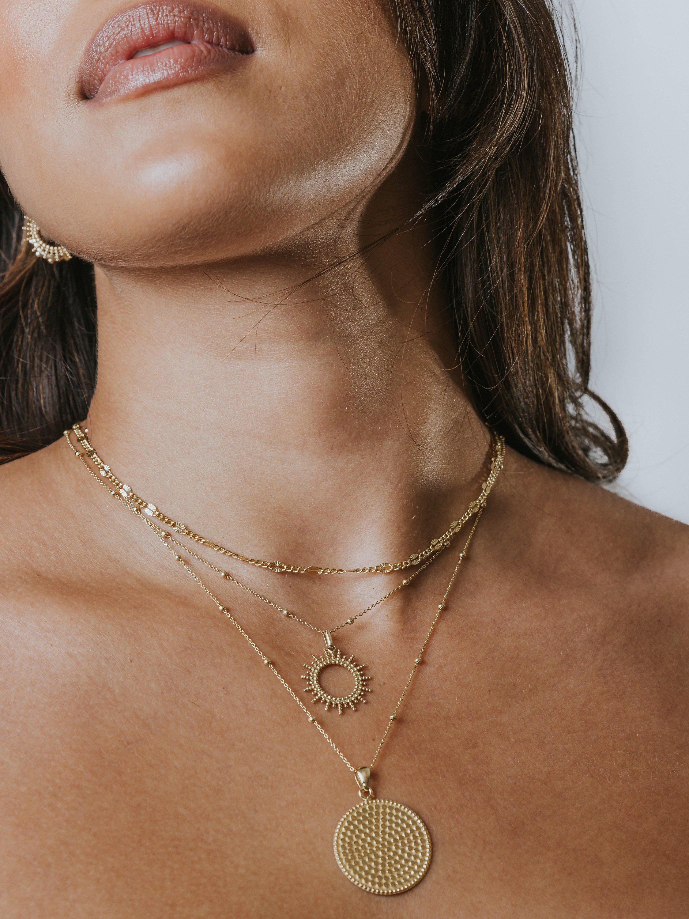 Product image 2 of 3, which shows LARNAUTI Beaded Chain Sunburst Pendant Necklace, Gold