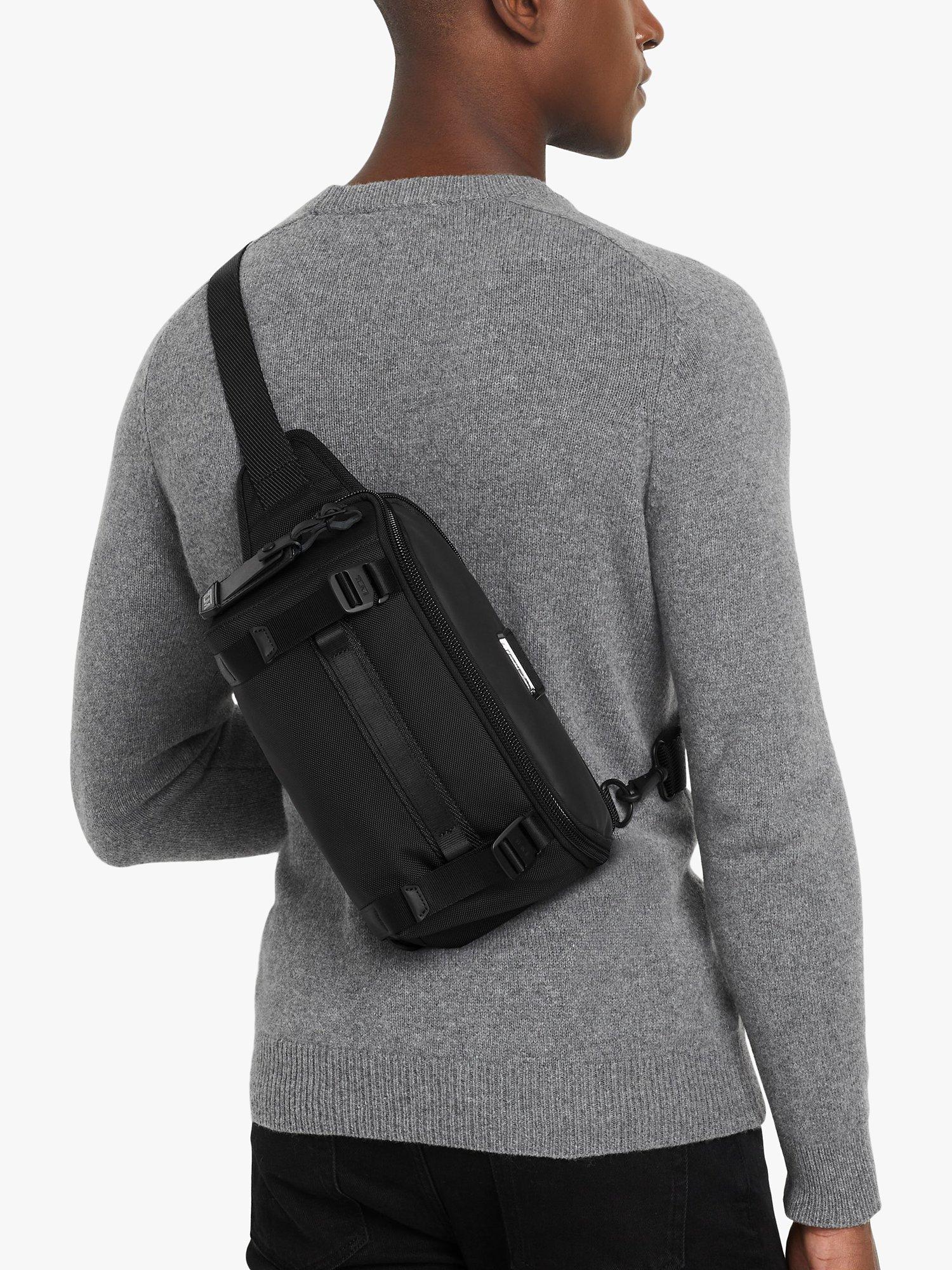 Product image 2 of 7, which shows TUMI Platoon Sling Bag, Black