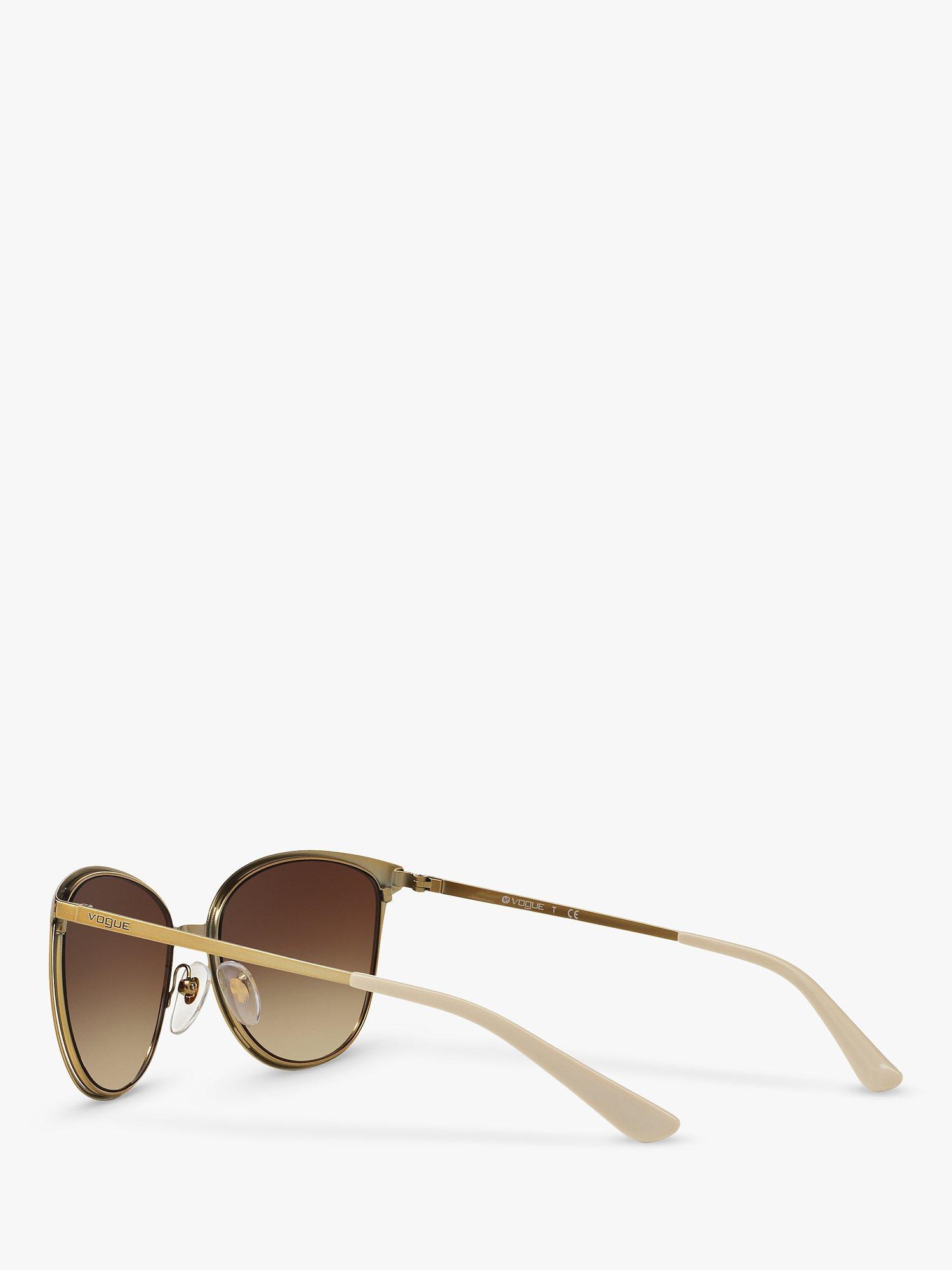 Product image 5 of 11, which shows Vogue VO4002S Women's Oval Sunglasses, Brushed Gold/Brown Gradient