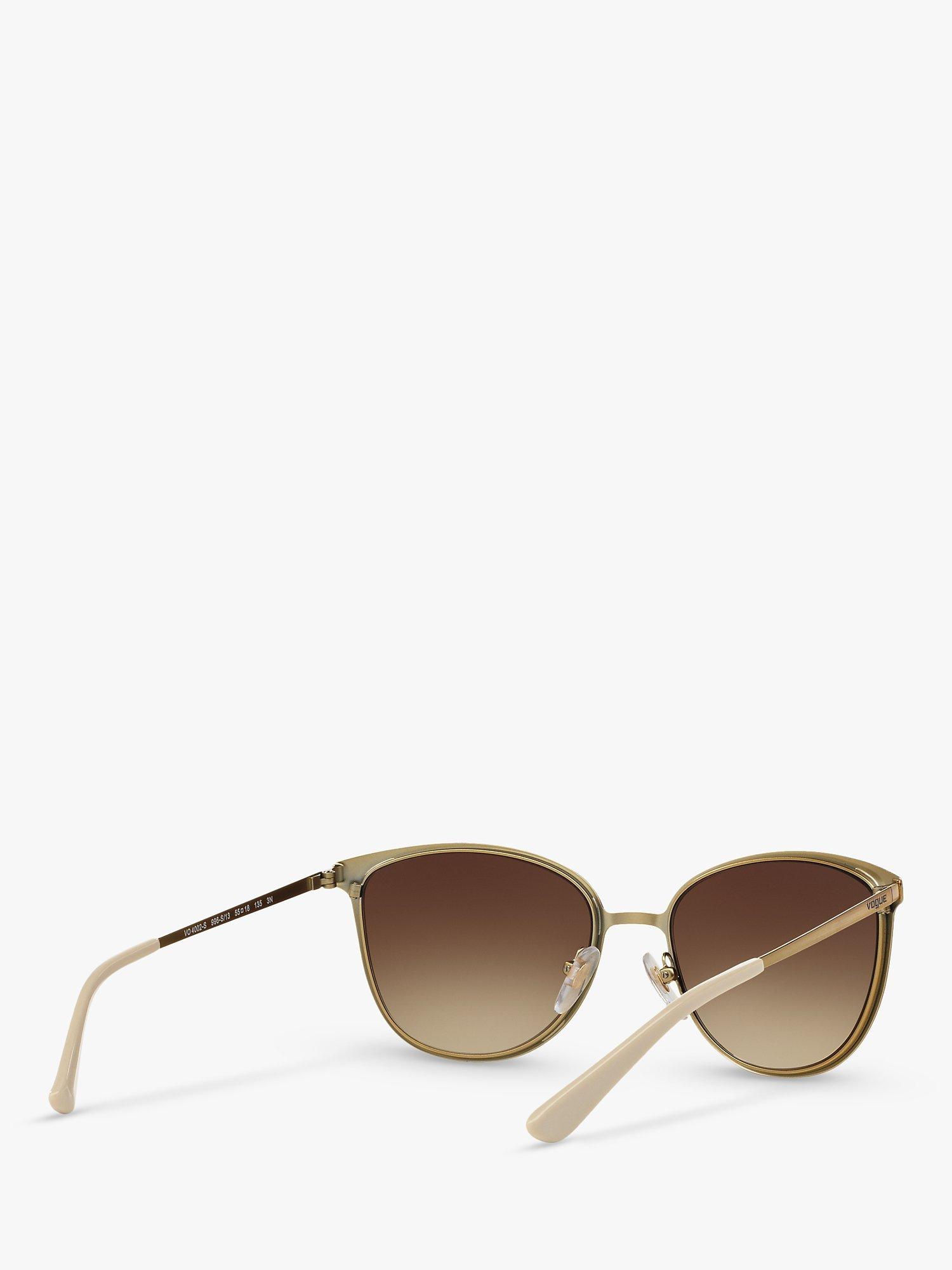 Product image 8 of 11, which shows Vogue VO4002S Women's Oval Sunglasses, Brushed Gold/Brown Gradient