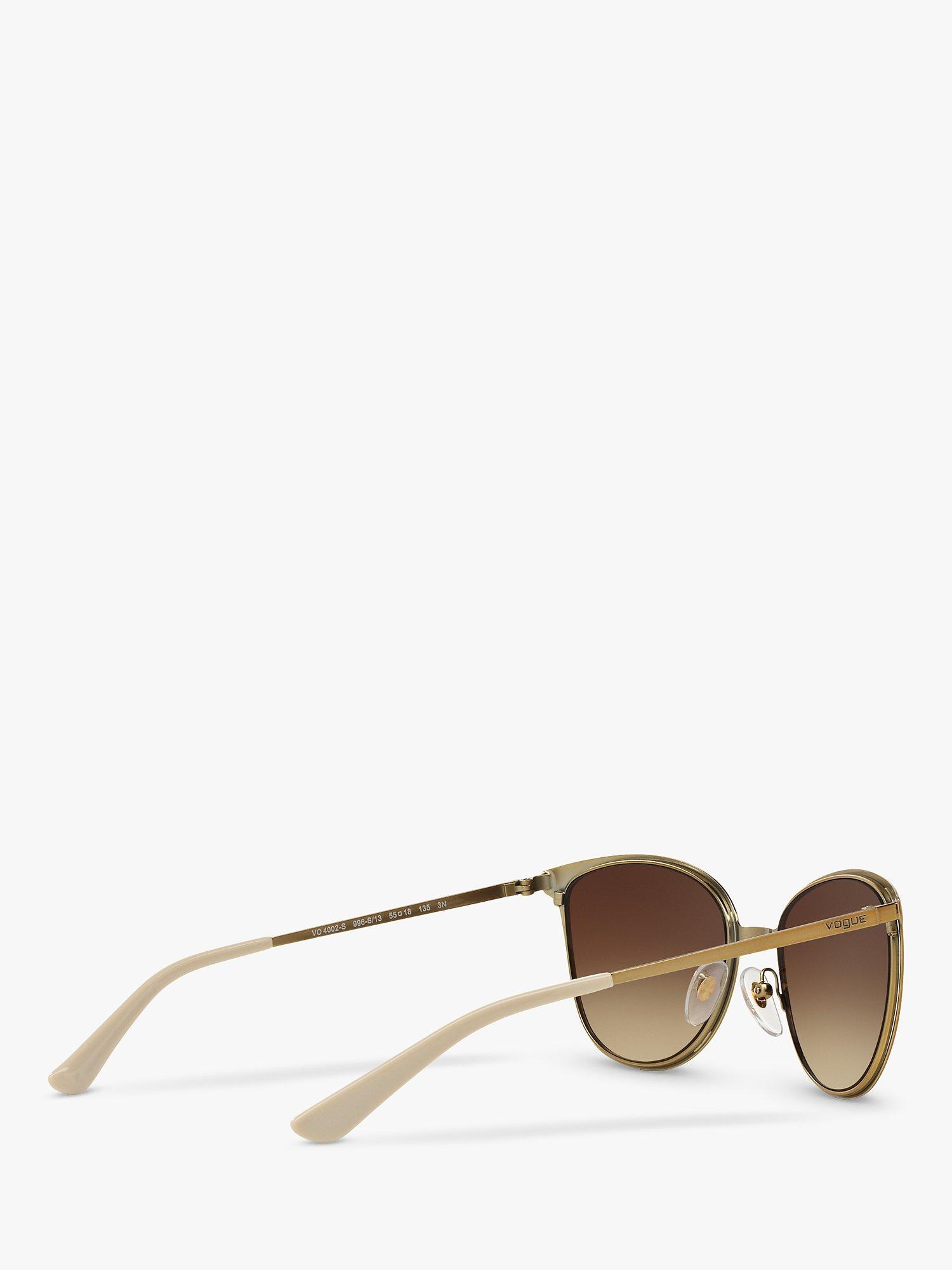 Product image 9 of 11, which shows Vogue VO4002S Women's Oval Sunglasses, Brushed Gold/Brown Gradient