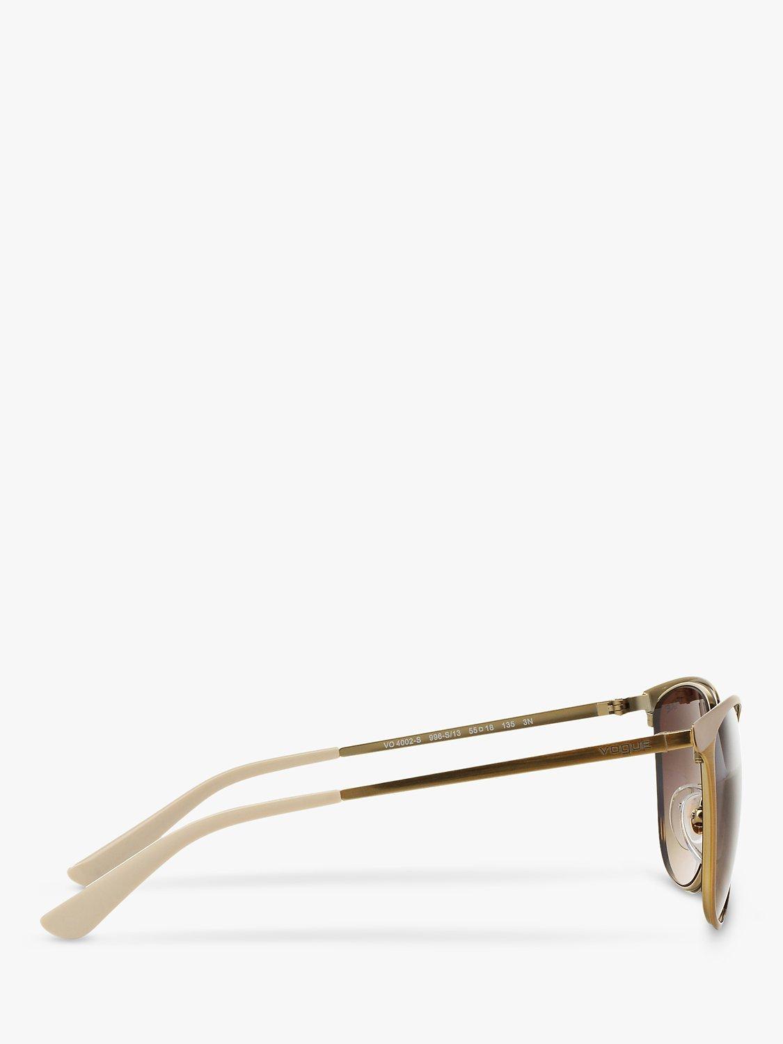 Product image 10 of 11, which shows Vogue VO4002S Women's Oval Sunglasses, Brushed Gold/Brown Gradient