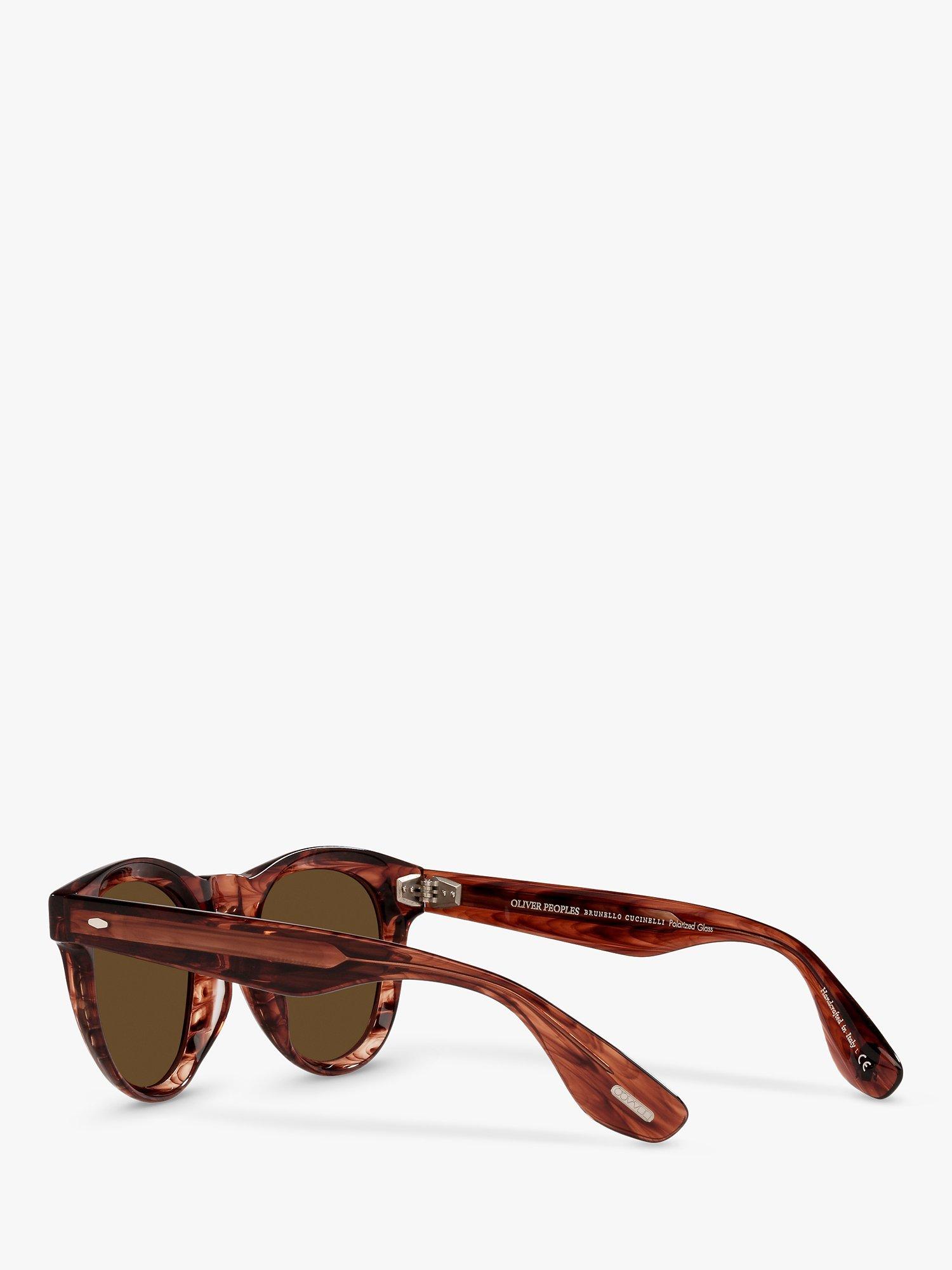 Product image 5 of 11, which shows Oliver Peoples OV5473SU Unisex Nino Polarised Oval Sunglasses, Dark Amber Smoke/Brown