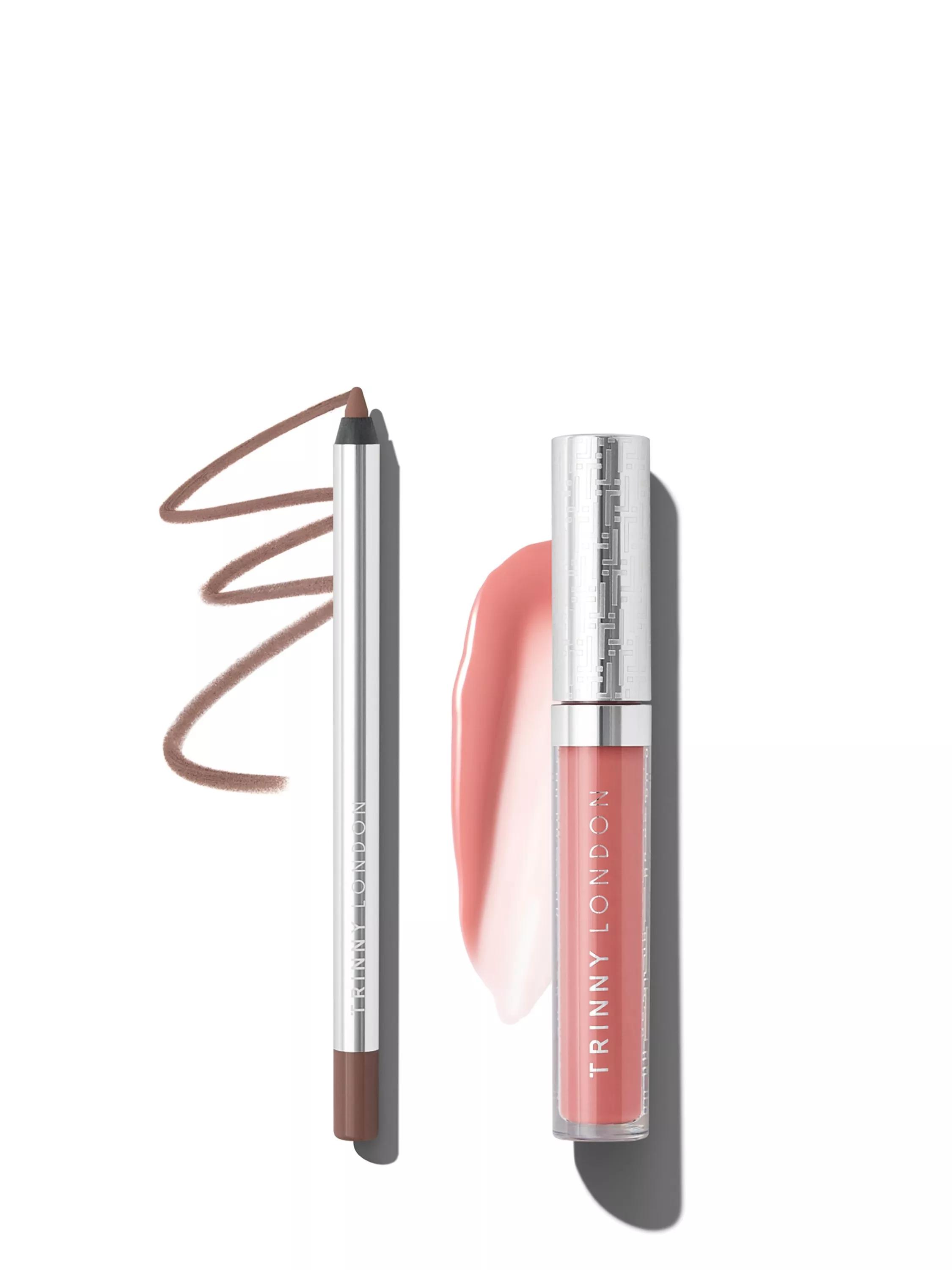 Trinny London brown eyeliner pencil with swatch, alongside pink lip gloss tube on white background
