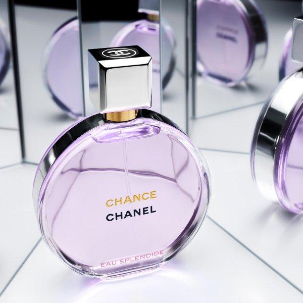 Chanel frangrance bottle next to several mirrors