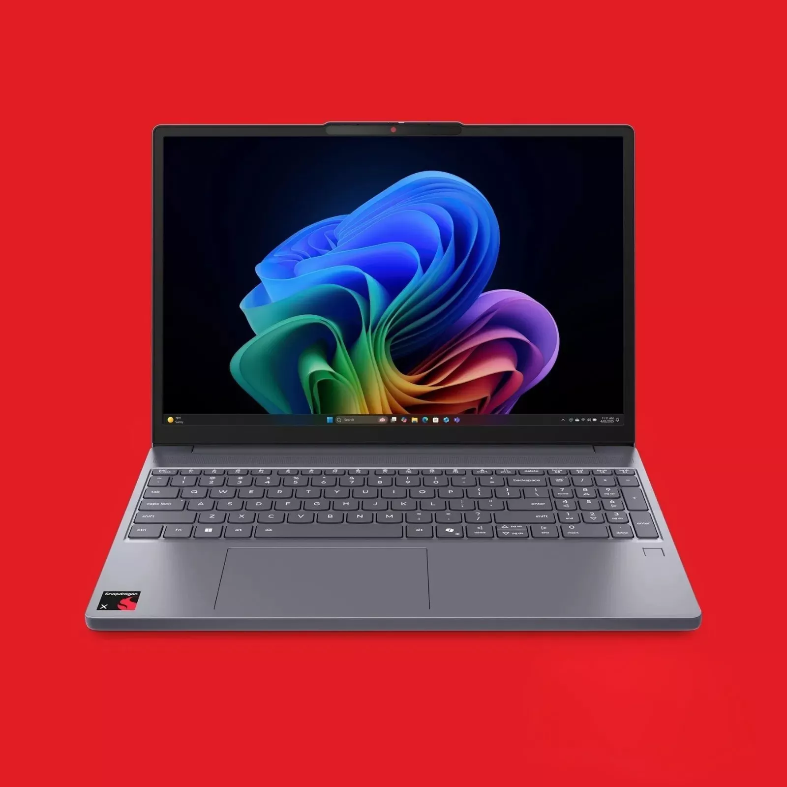 A sleek laptop with vibrant screen art on a red background, featuring Snapdragon and Copilot+PC logos.