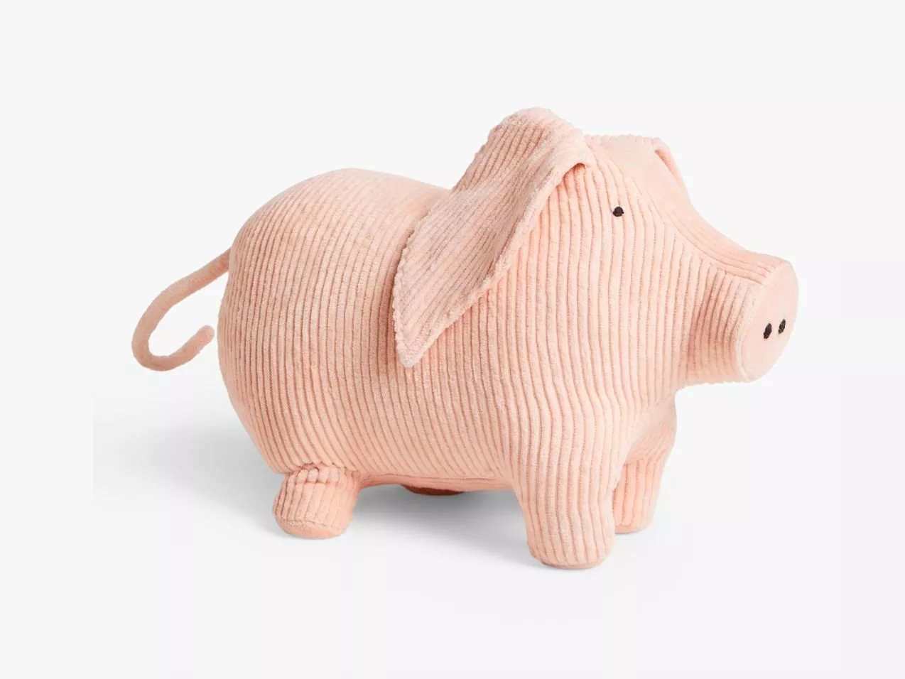 Soft pink corduroy pig plush toy with floppy ears and stitched face, isolated on white background