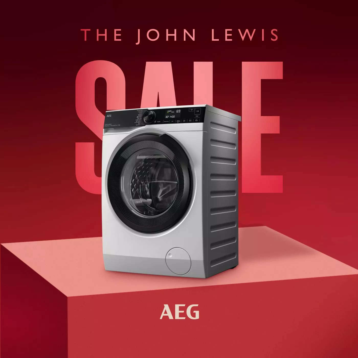 John Lewis sale advert featuring AEG tumble dryer on red podium with bold SALE text in background