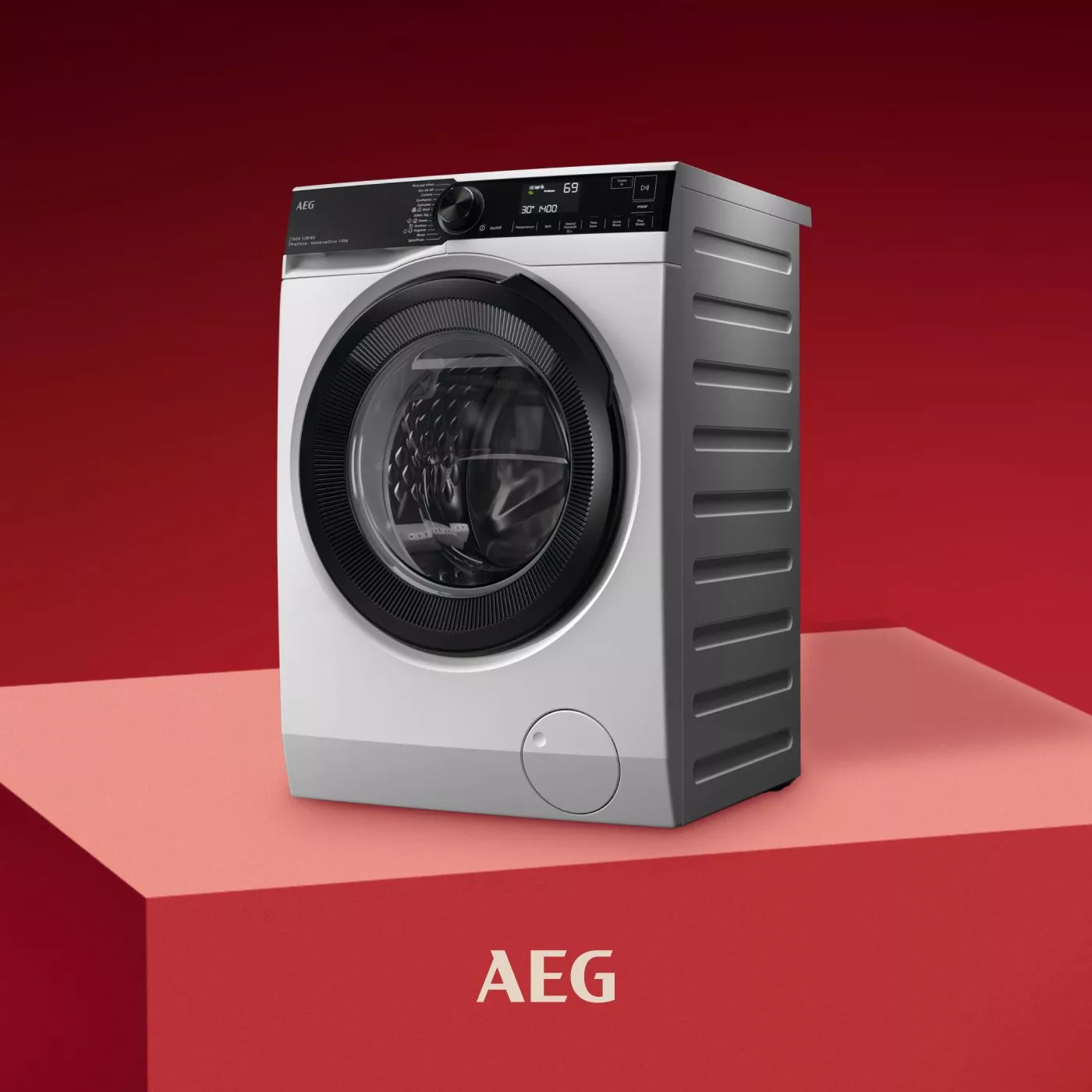 John Lewis sale advert featuring AEG tumble dryer on red podium with bold SALE text in background