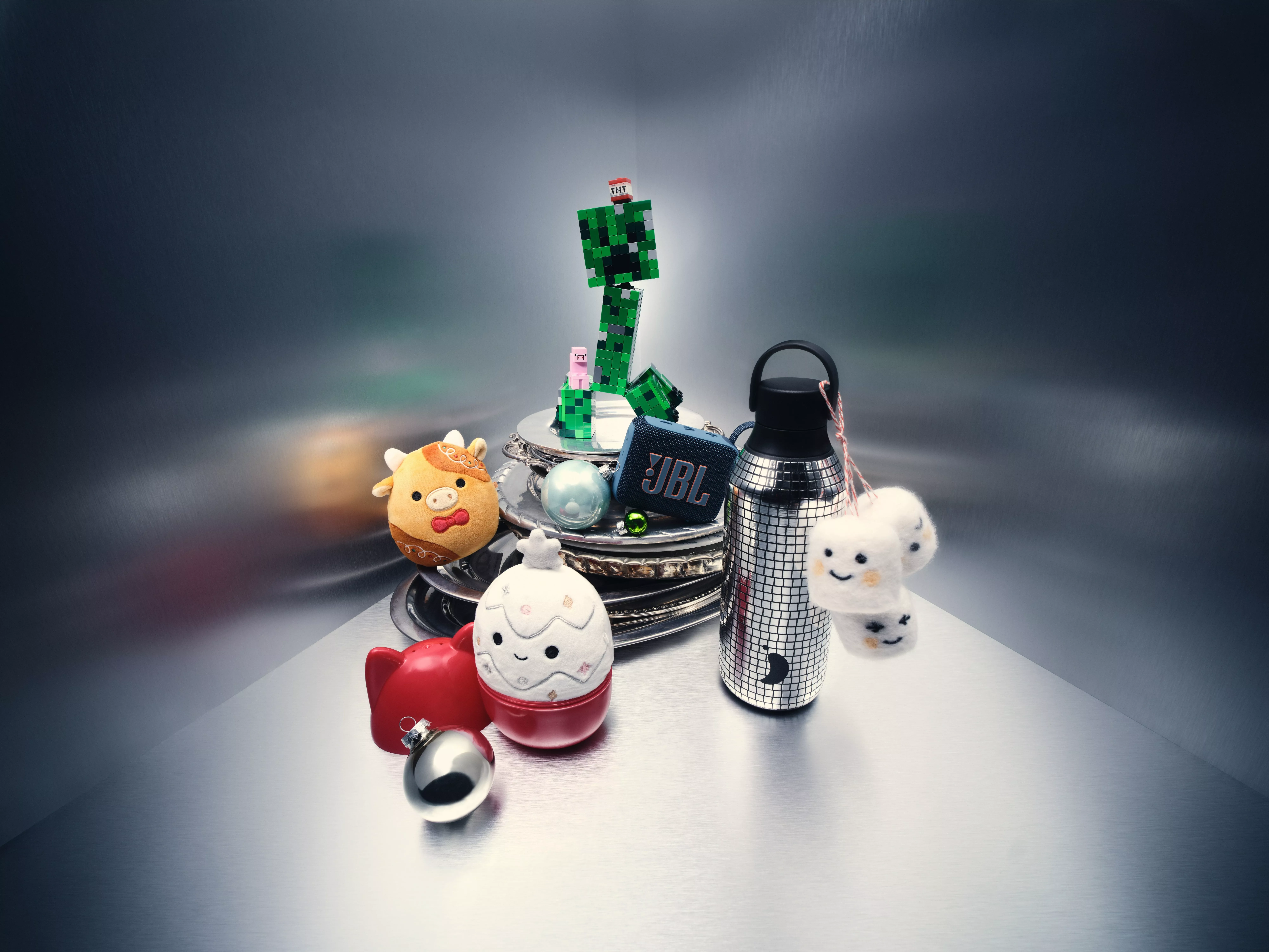 A grouping of festive ornaments and a JBL speaker