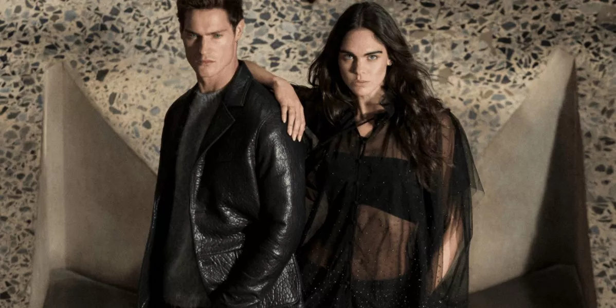 This is a banner for AllSaints showing two models