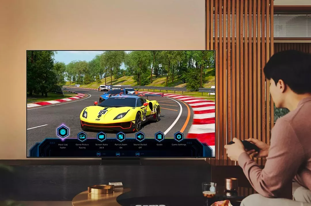 Person playing a video game on a big TV screen