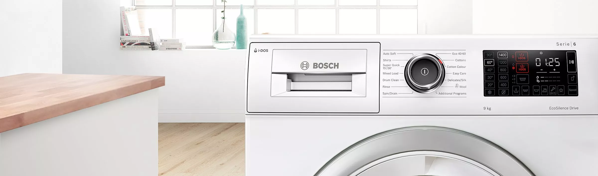 Close-up of Bosch Series 6 washing machine control panel with i-DOS display in modern bright laundry room