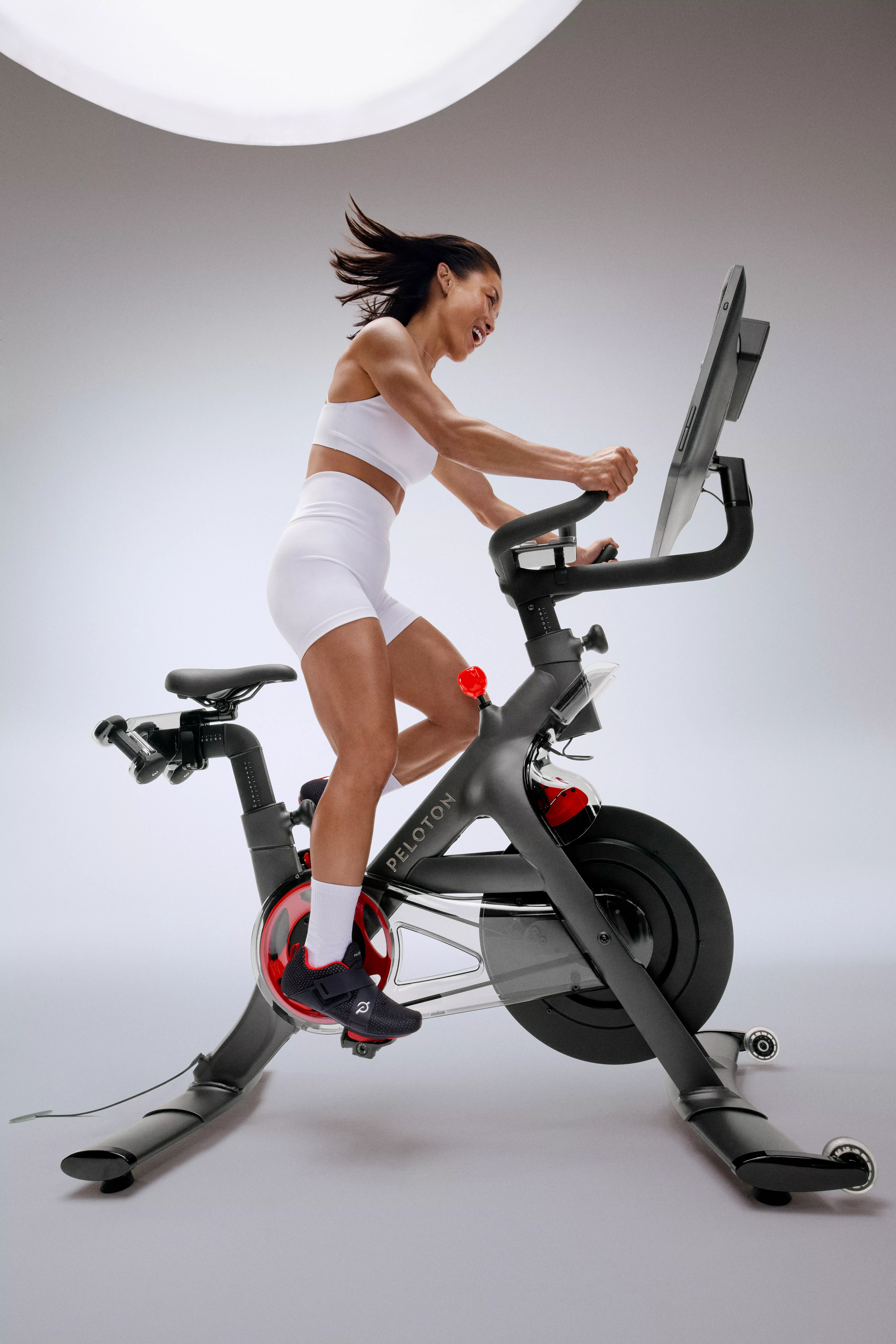 woman on a Peloton exercise bike