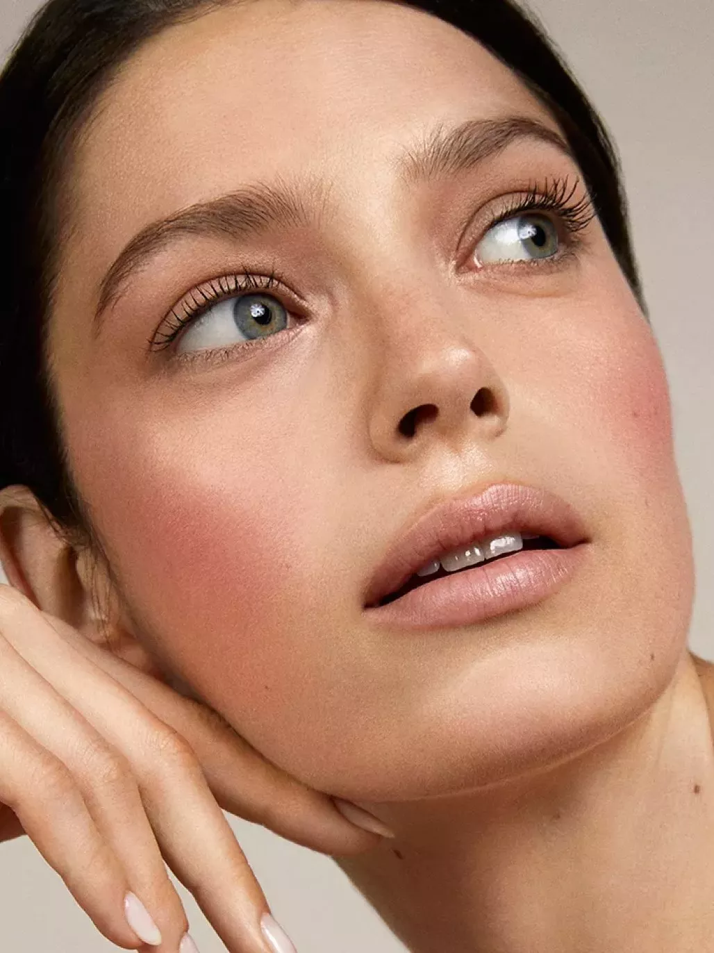 Person posing with a full face of makeup