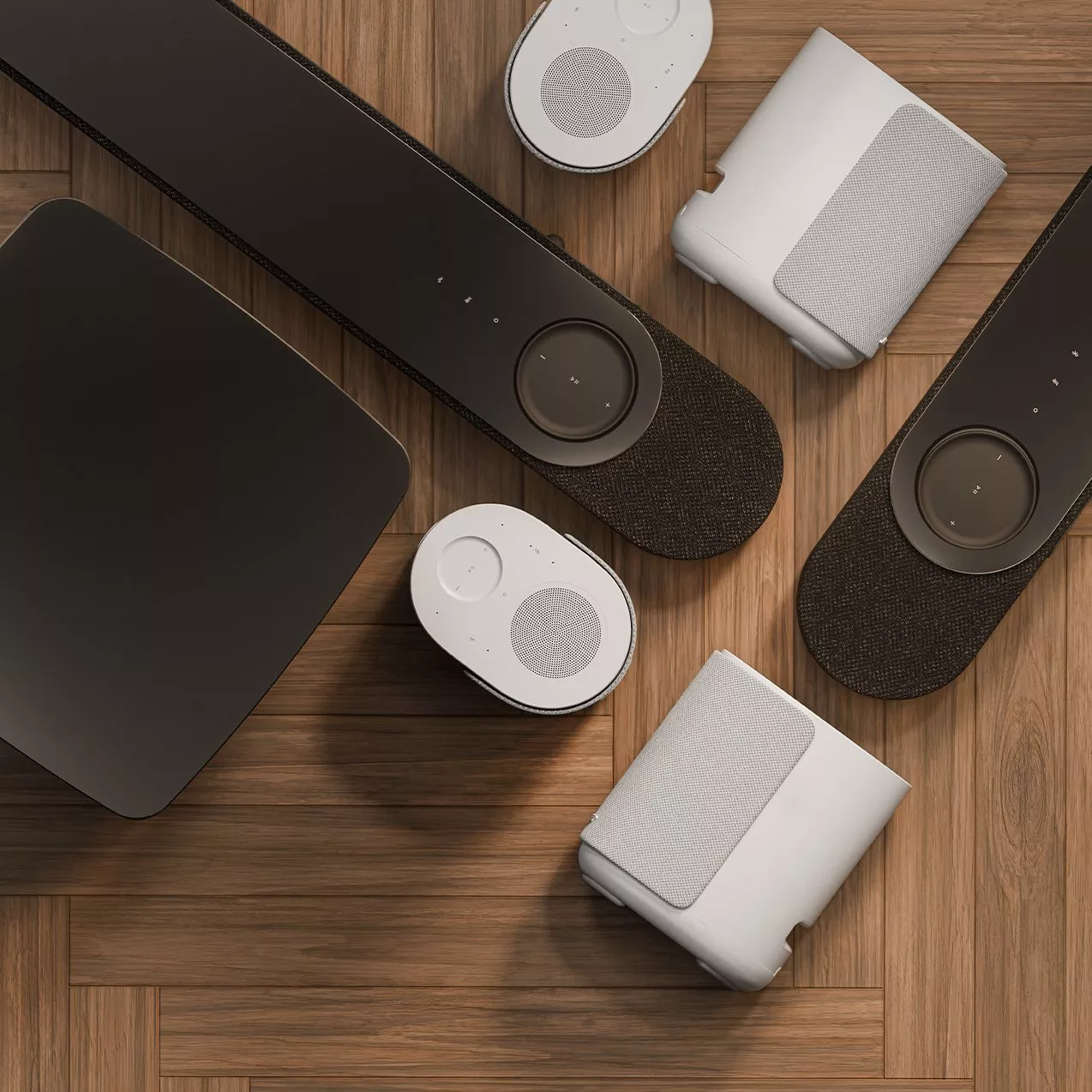 Bose portable Bluetooth speaker on a table, with a person holding a smartphone to control music indoors.