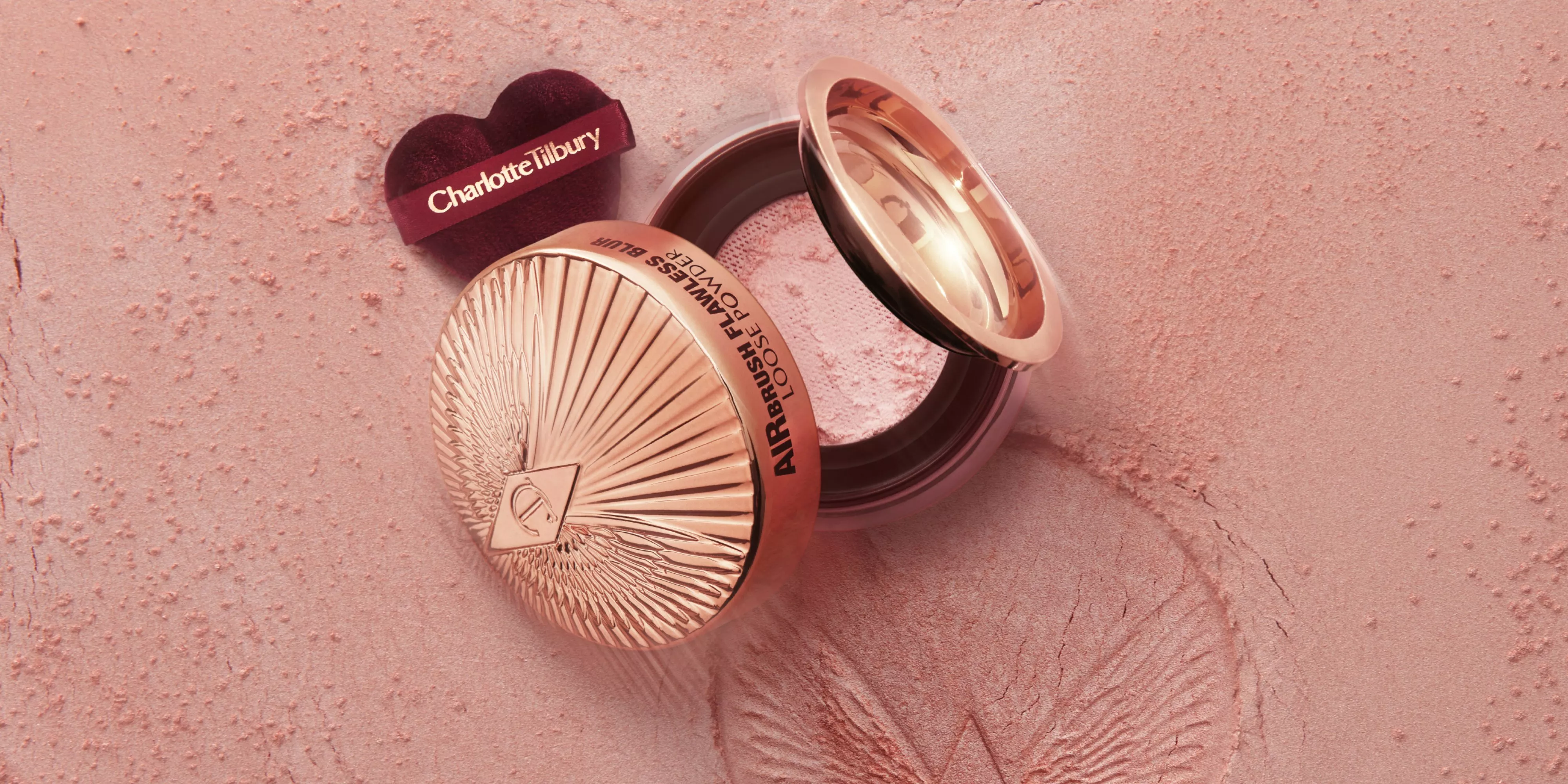 Charlotte Tilbury Airbrush Flawless Finish powder compact with shade swatches on a soft peach background