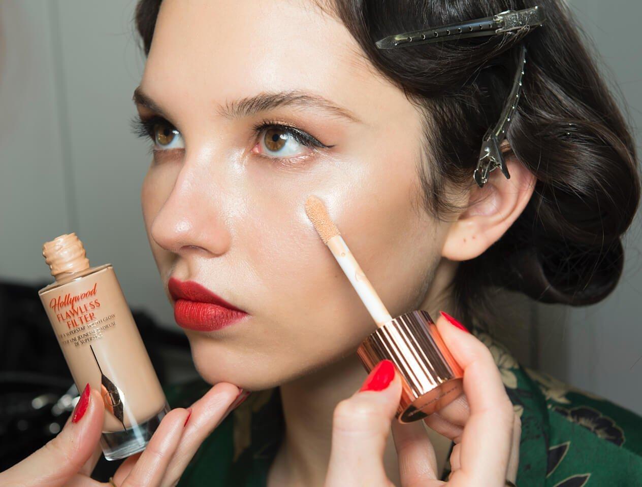 Charlotte Tilbury applying model's makeup backstage at Alice Temperley LFW