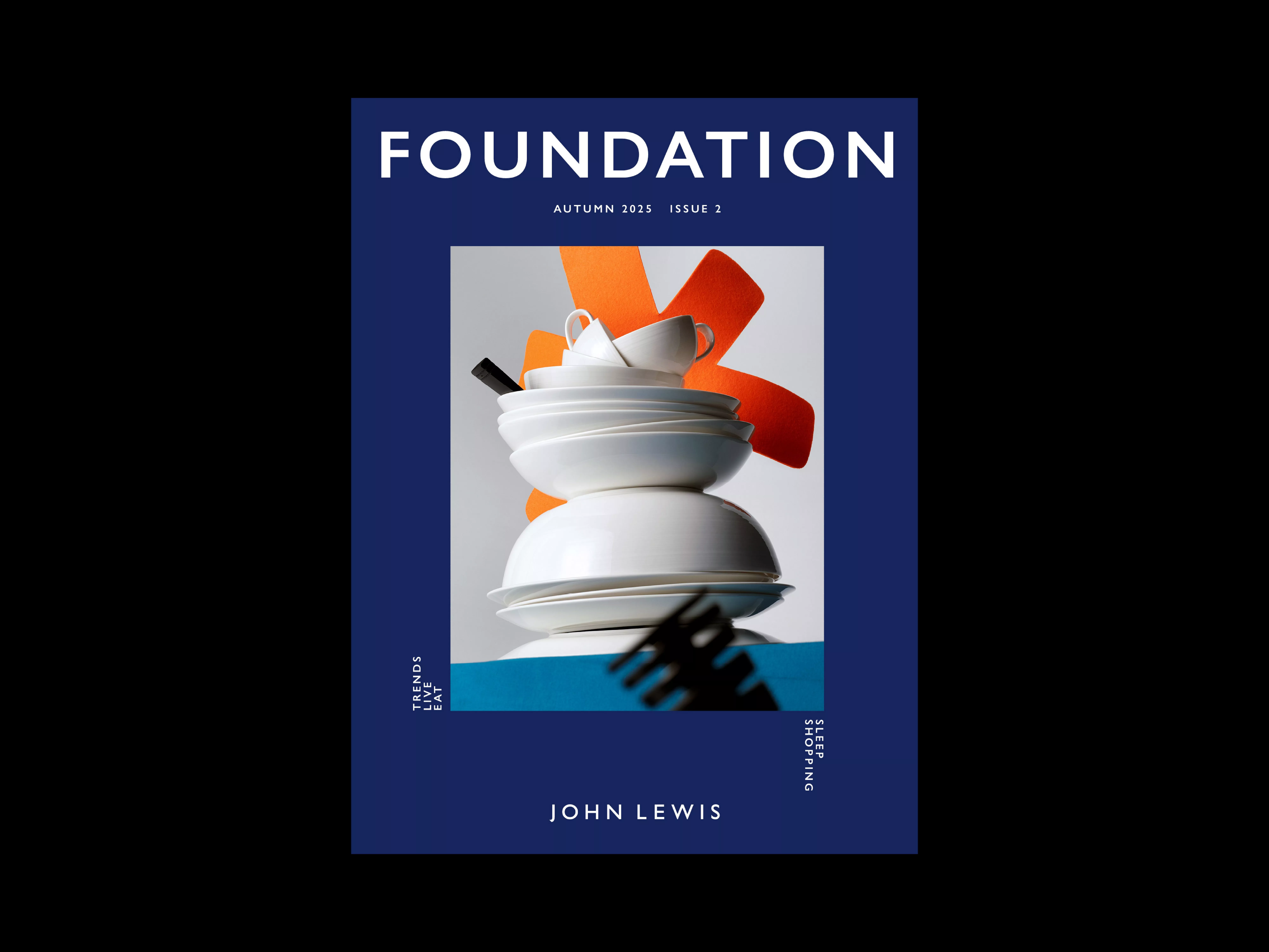 Stacked white crockery against a blue background on John Lewis Foundation magazine cover, Autumn 2023 issue.
