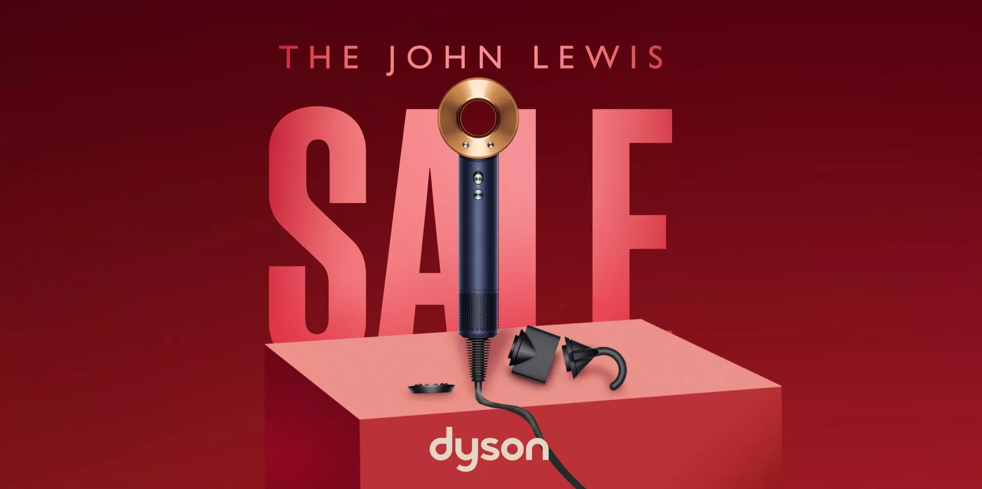 John Lewis sale advert featuring Dyson Supersonic hair dryer with styling attachments on red background and bold SALE text