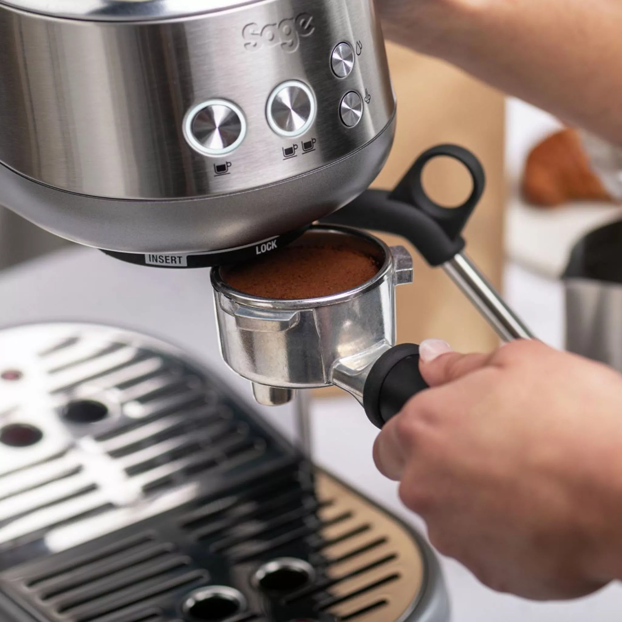 Portafilter being added to a Sage coffee machine