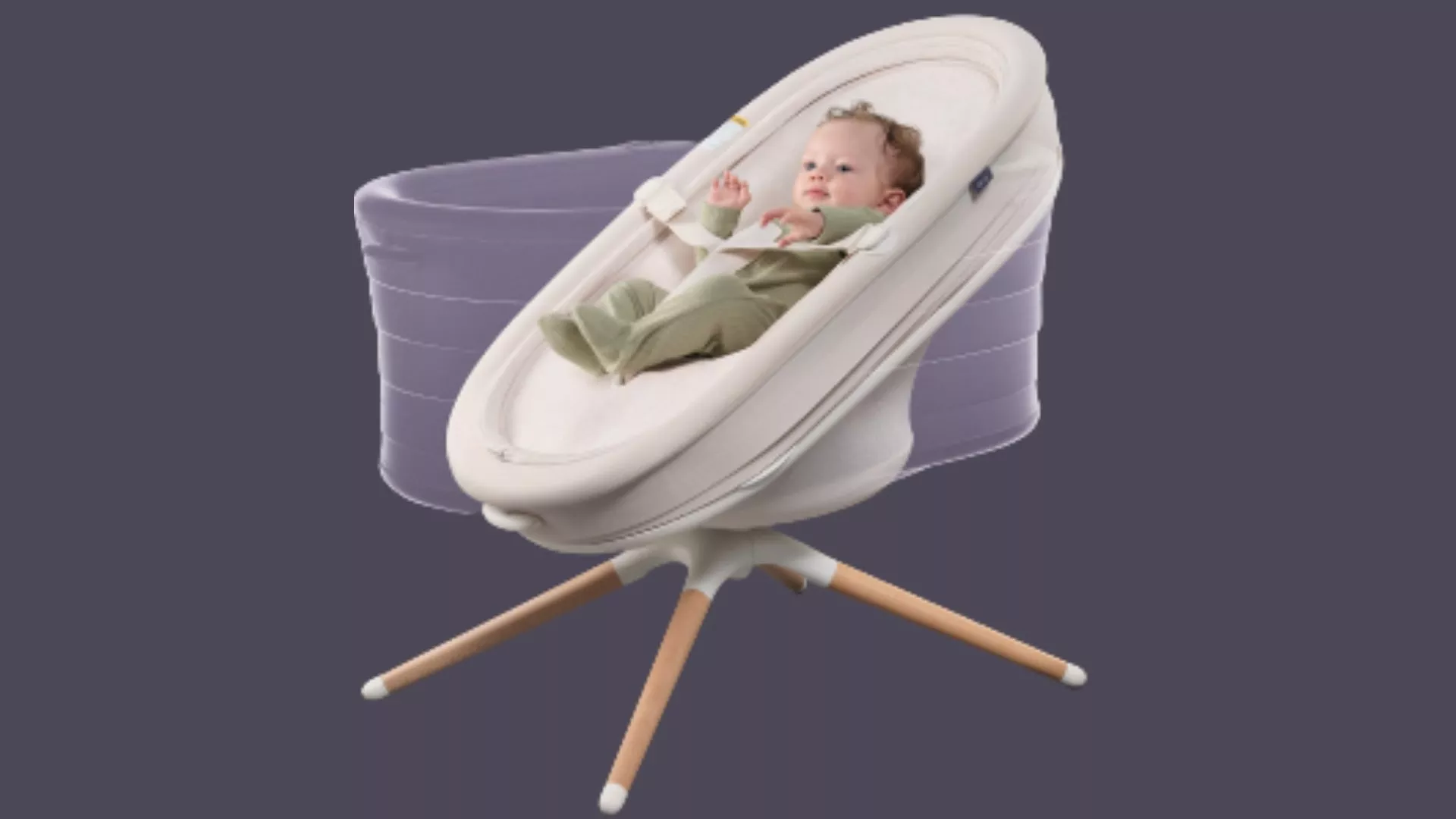 A baby lying in a cream smart bassinet with wooden legs, showing a motion effect demonstrating its swaying motion against a purple background.