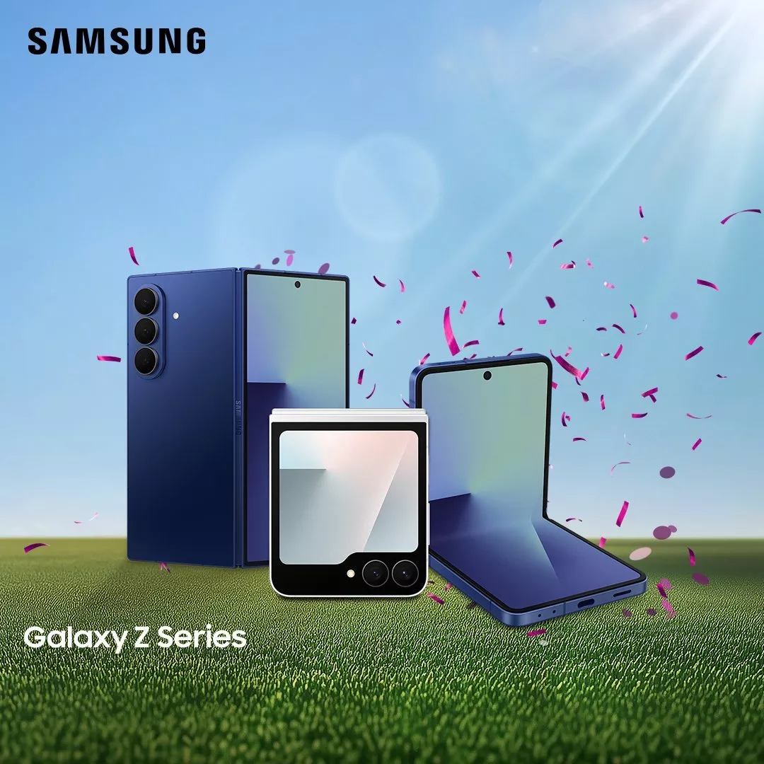 Samsung Galaxy Z Series foldable smartphones and flip phone on grass with blue sky and confetti backdrop