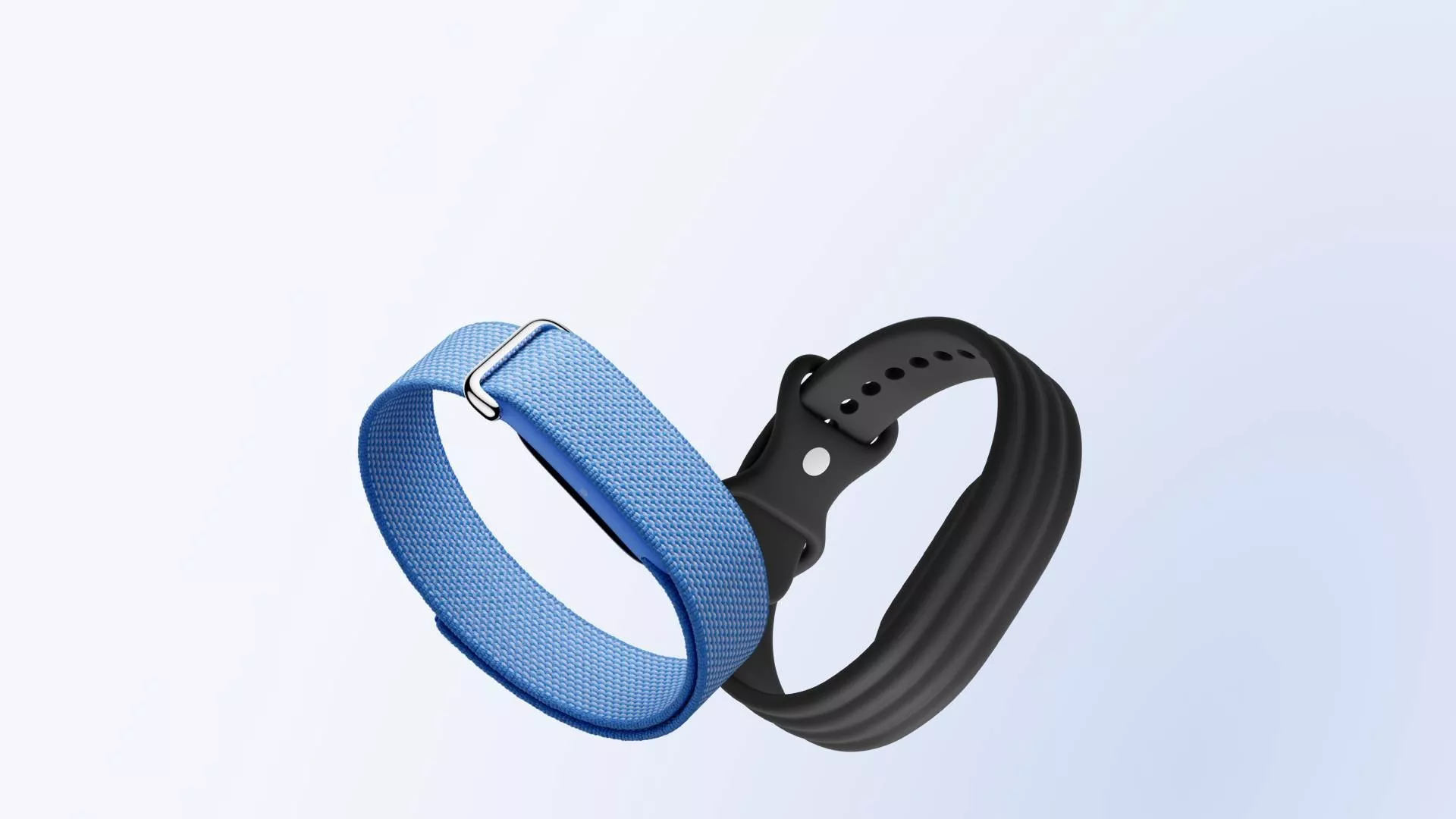 Blue woven fabric and black silicone fitness tracker wristbands, interchangeable smartwatch straps on light background