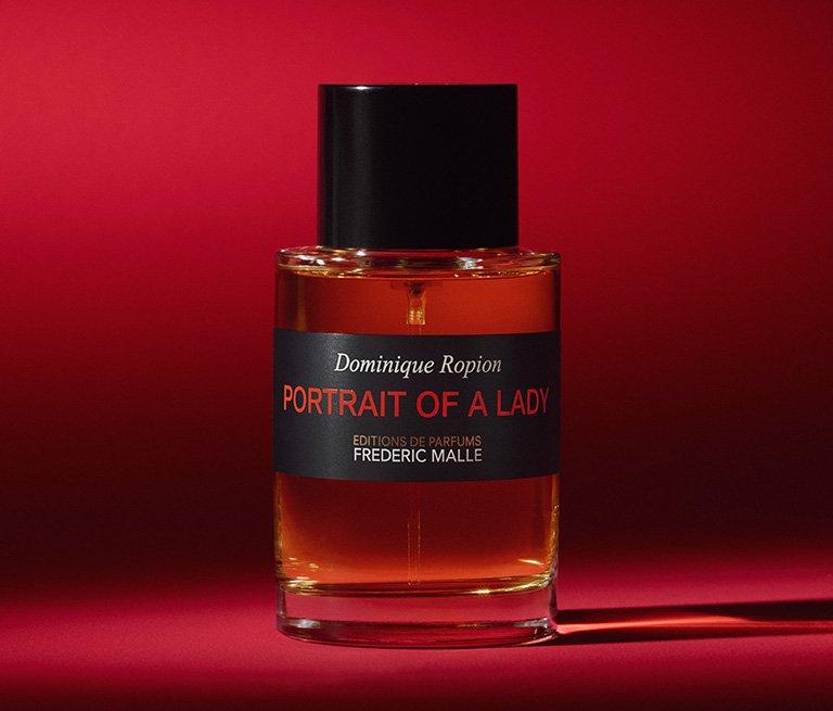 This is a brand banner for Frederic Malle showing a black perfume bottle on a red background.