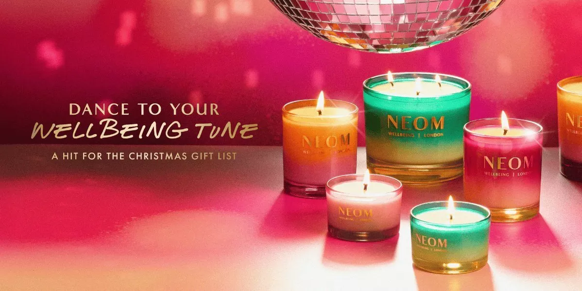 Banner showing different NEOM candles on a red background.