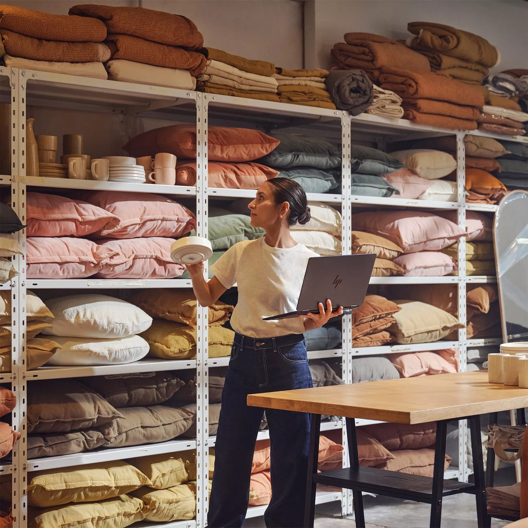 A modern Hisense smart TV on a wooden stand displaying various streaming apps. "Which? Best Buy" badge visible.