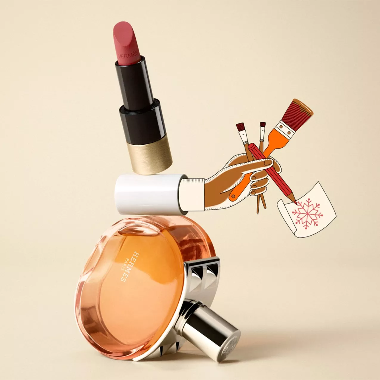 Whimsical Hermès collage featuring a pink lipstick balanced on a perfume bottle, with an illustrated hand holding brushes and sketching a red snowflake.