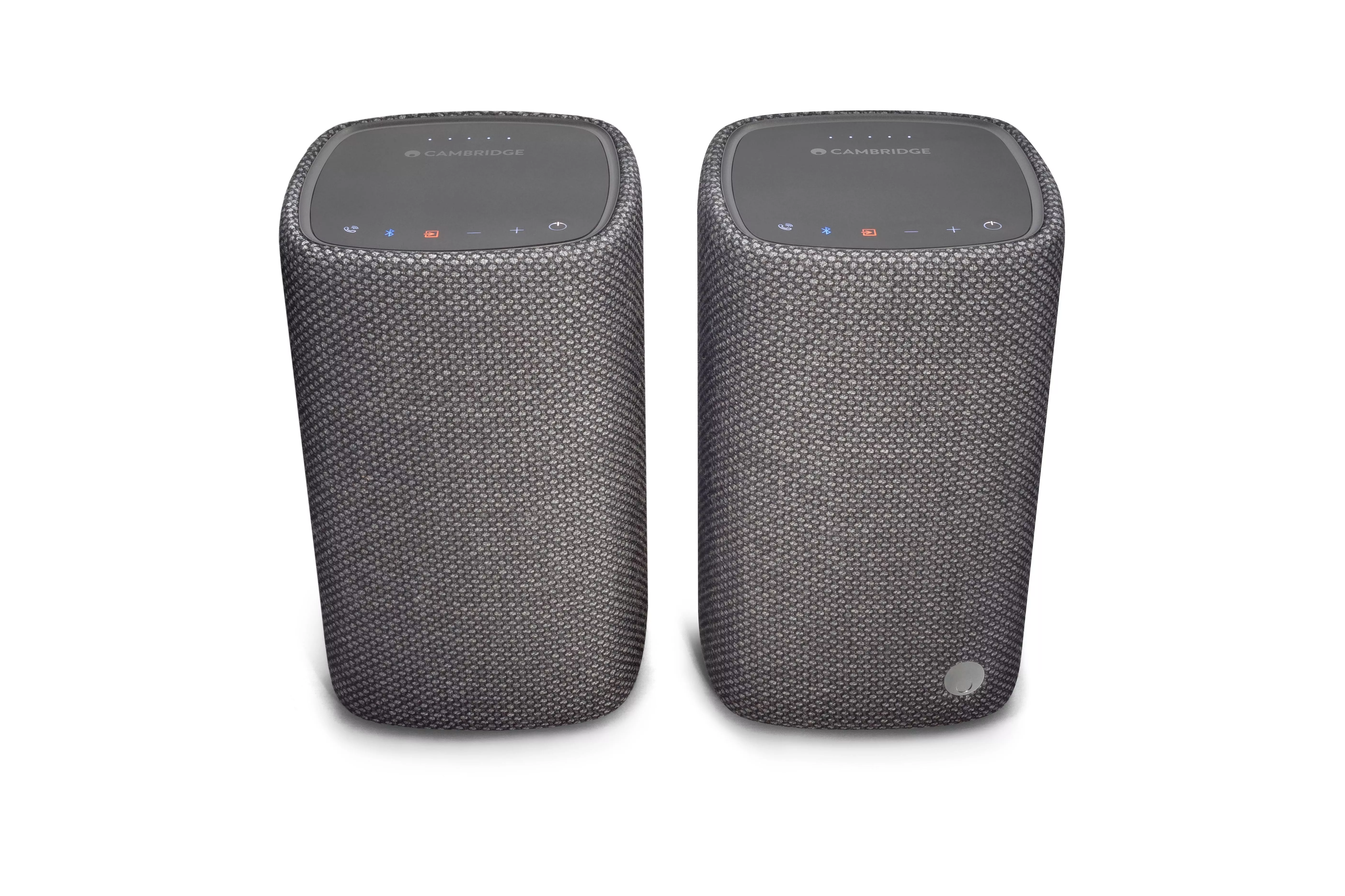 Pair of Cambridge wireless Bluetooth speakers in grey fabric with top touch controls, front view on white background
